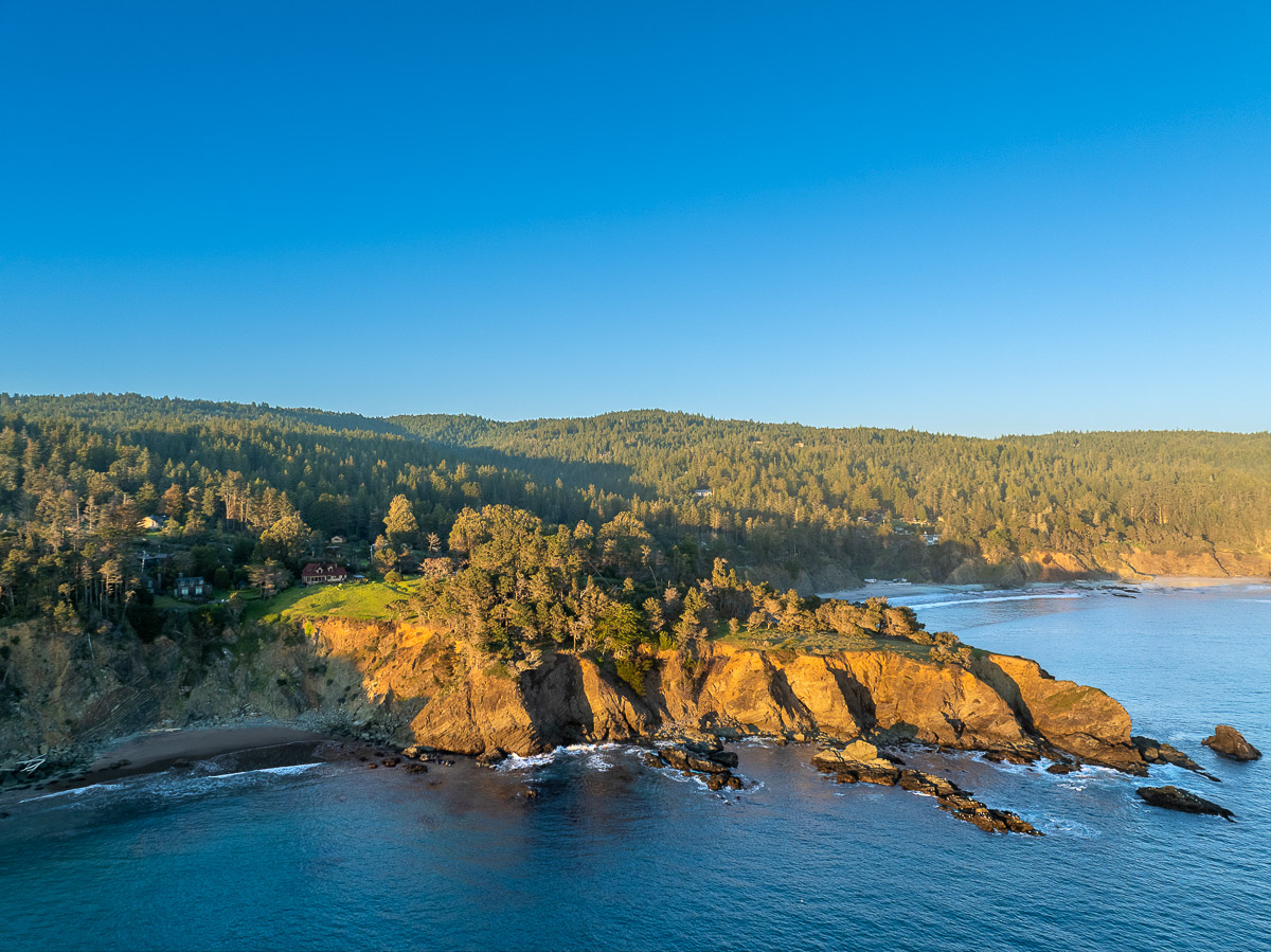 Oceanfront bluff retreat with sweeping views, sunsets, rugged coast.