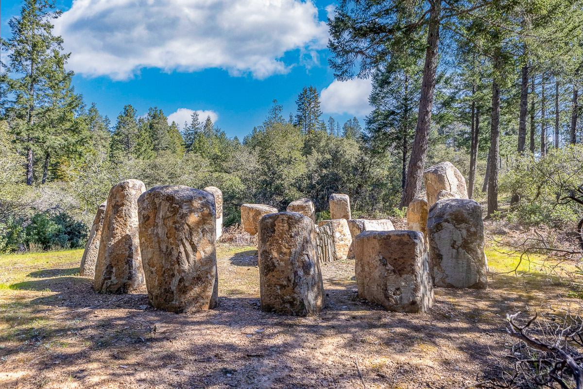 Private forest clearing with rustic stone circle for gatherings