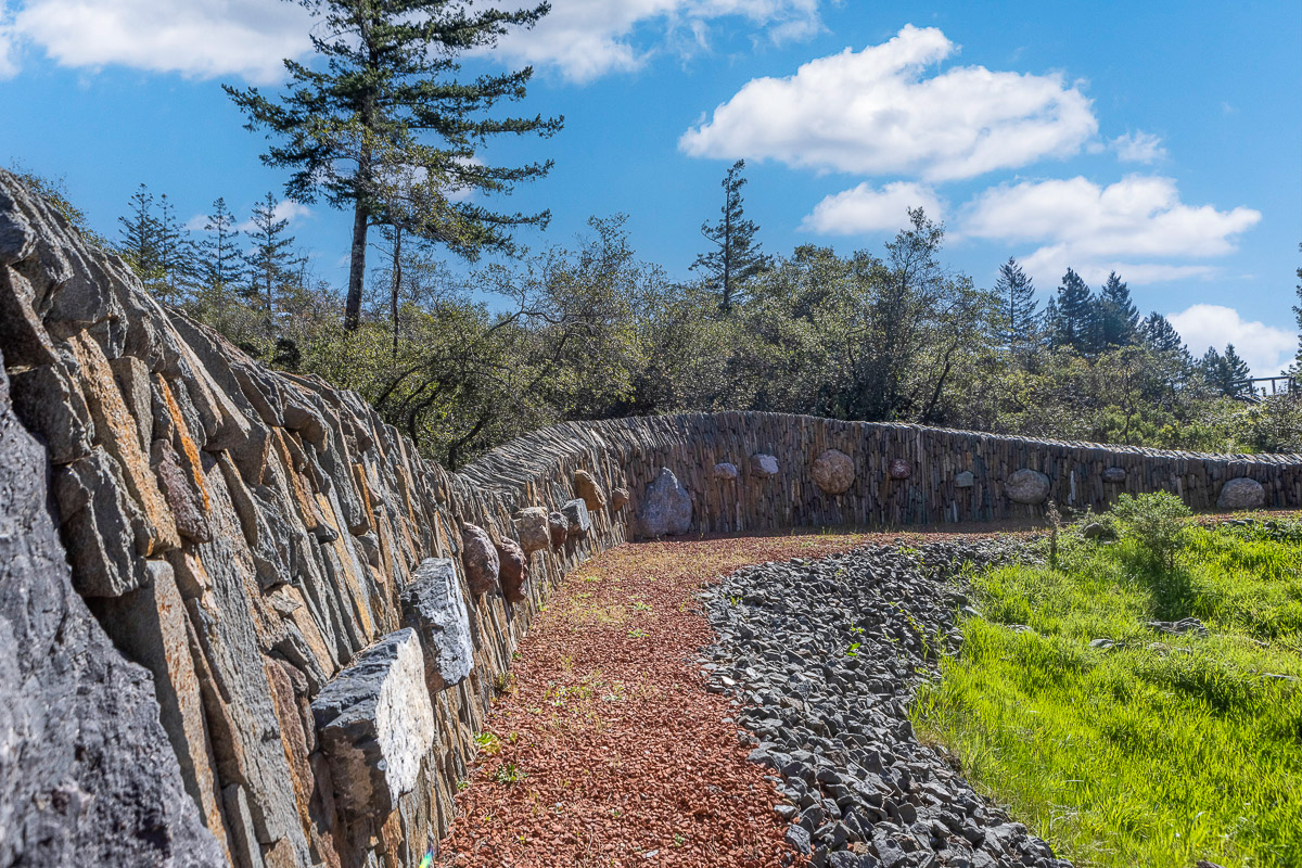 Scenic stone path through landscaped grounds and nature views