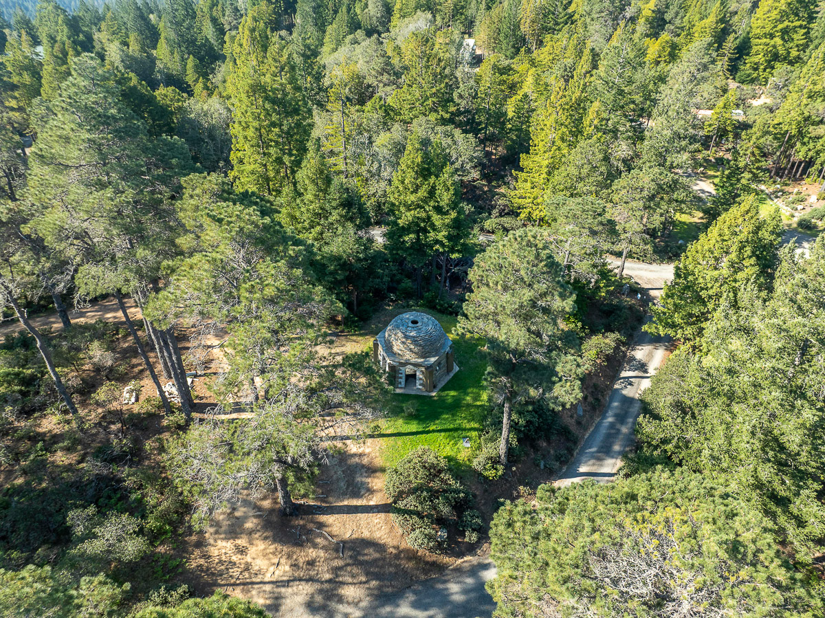 Secluded forest retreat with unique stone dome and winding drive
