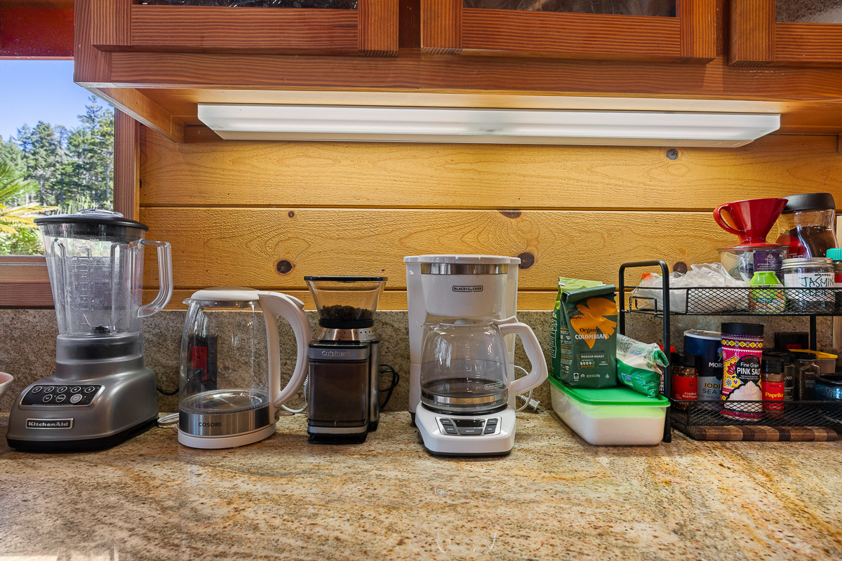 Fully stocked coffee bar: grinder, kettle, drip maker + cabin vibe
