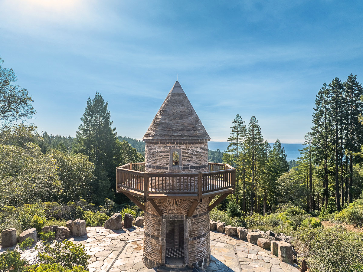 Fairytale stone tower with deck overlooking redwoods and ocean