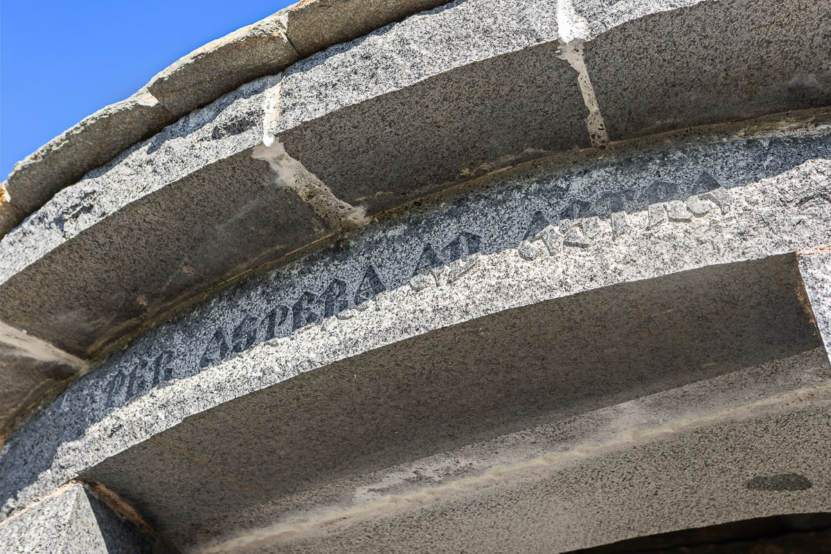 Historic granite archway showcases craftsmanship and timeless curb appeal