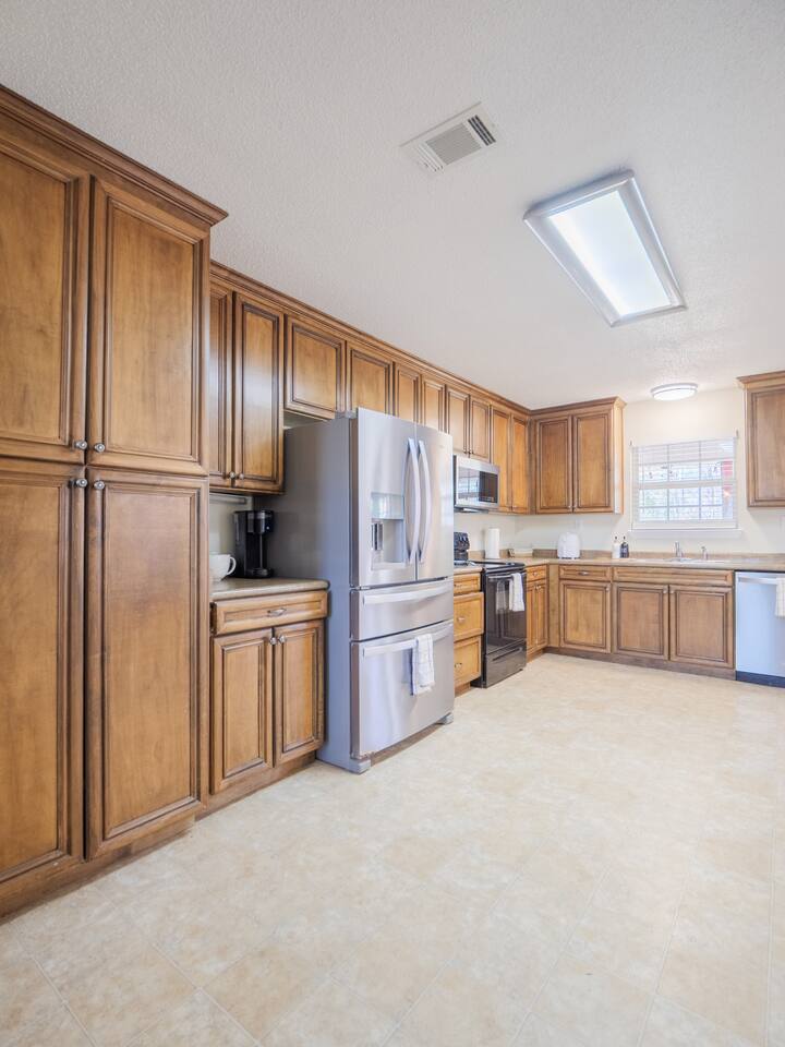 Kitchen with tall wood cabinets