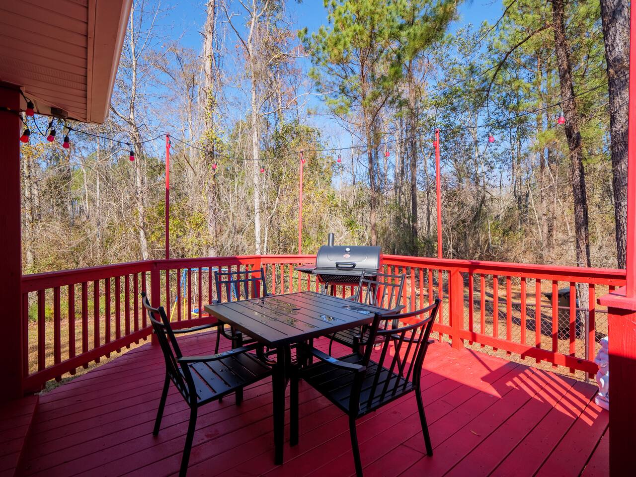 Deck dining table under tall Georgia pines