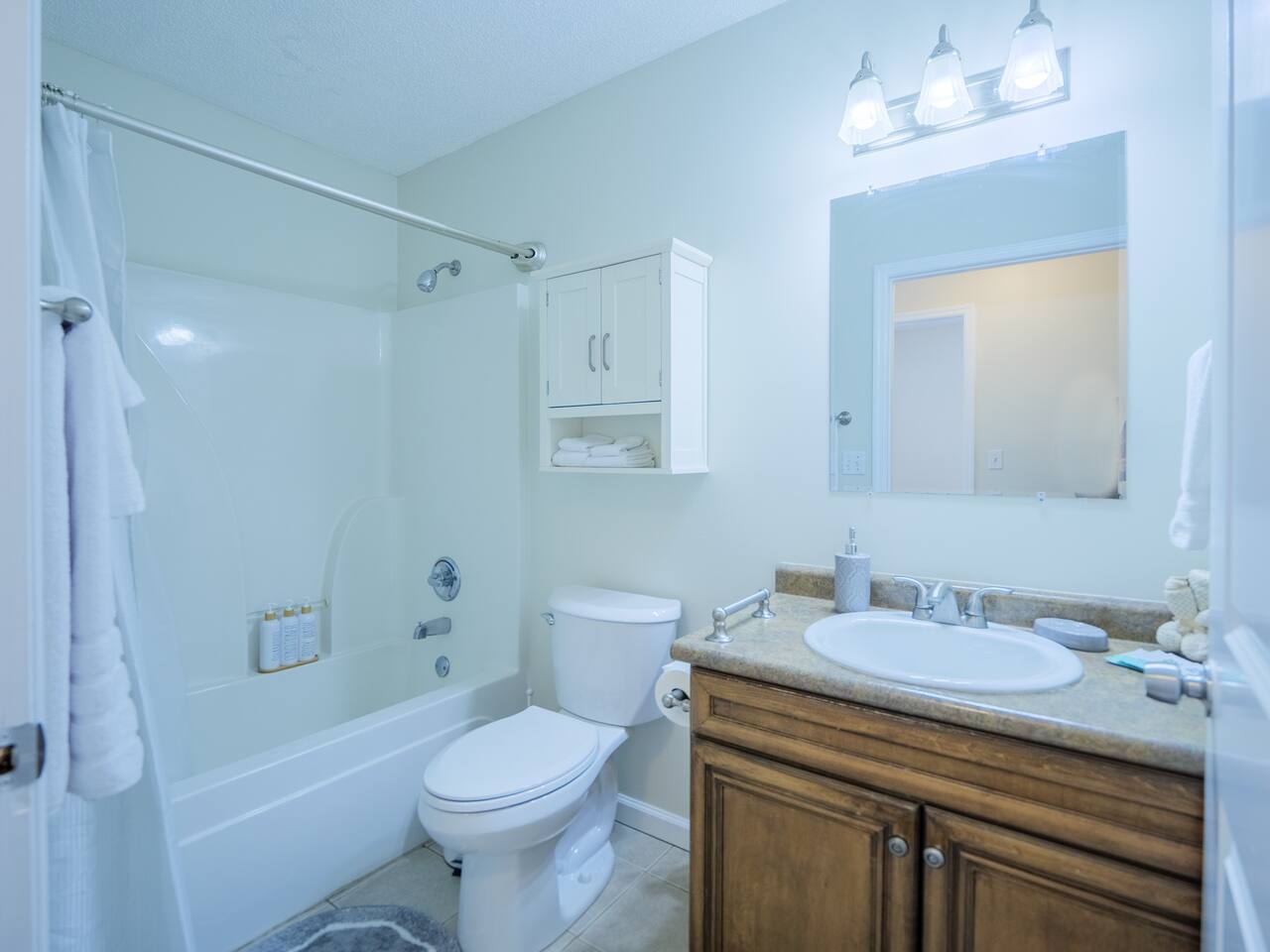Hall bathroom with tub and shower