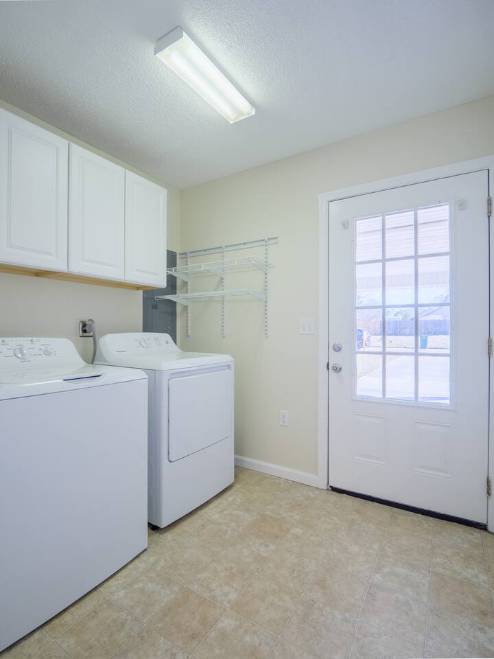 Laundry room with full-size washer and dryer