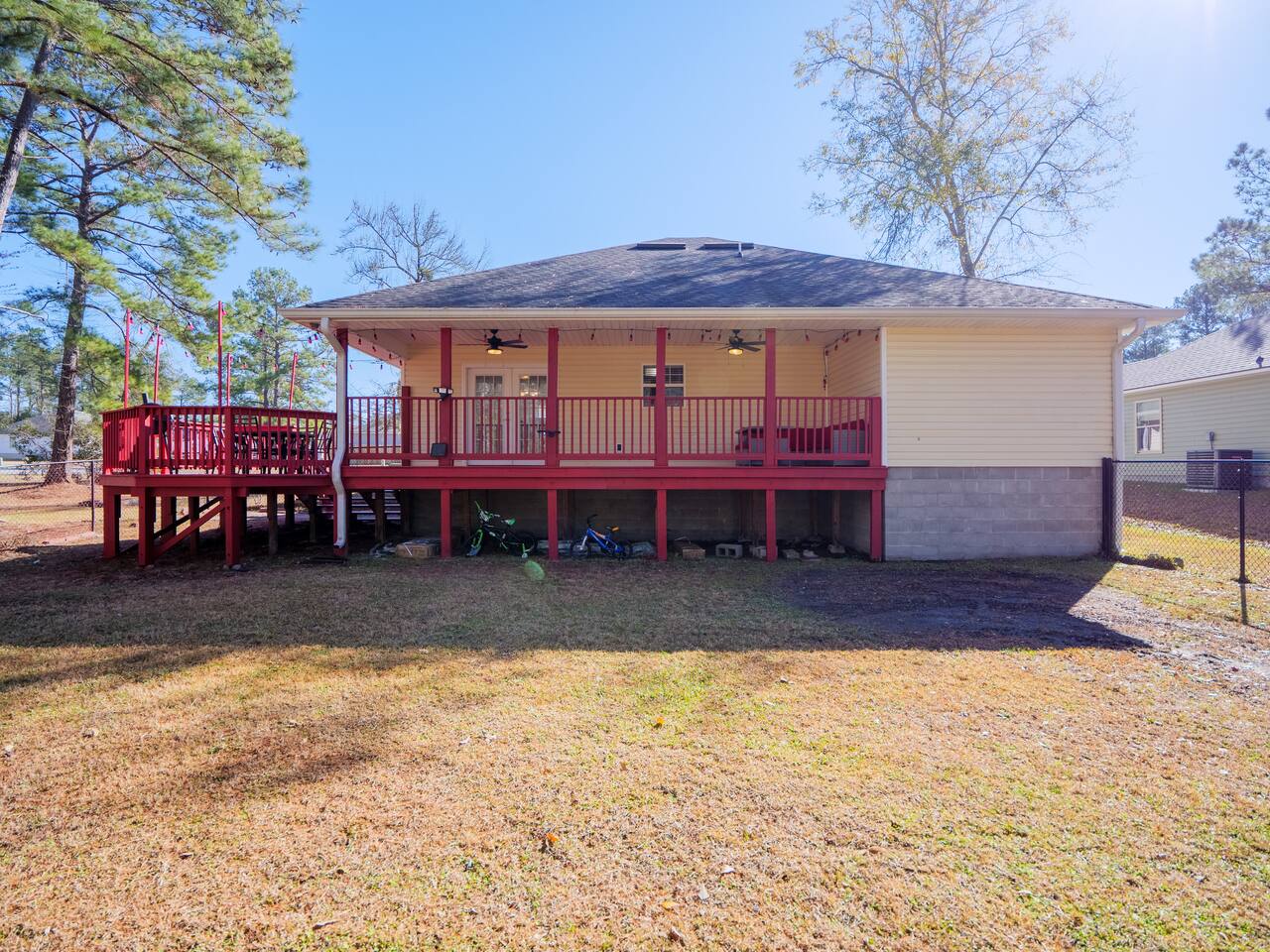 Back of the home with covered deck