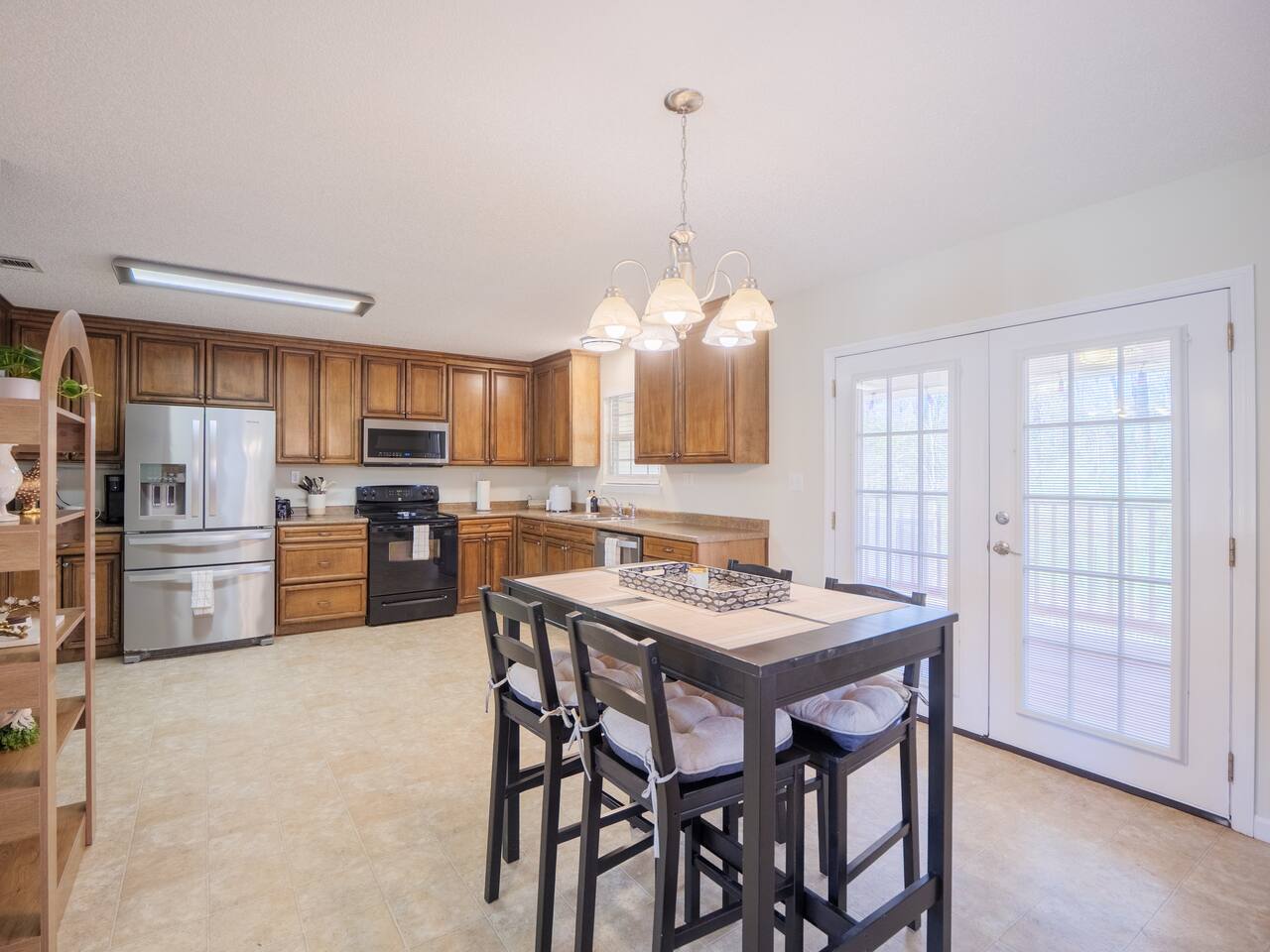 Kitchen and dining area with French doors to the deck