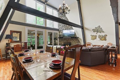 Dine in style with views of the living room and fireplace just beyond. The open layout makes entertaining effortless and keeps everyone connected.