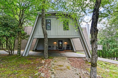 Iconic A frame design welcomes you with soaring angles and cozy lower level entry. This charming façade sets the tone for a warm, design forward getaway that feels both nostalgic and elevated.