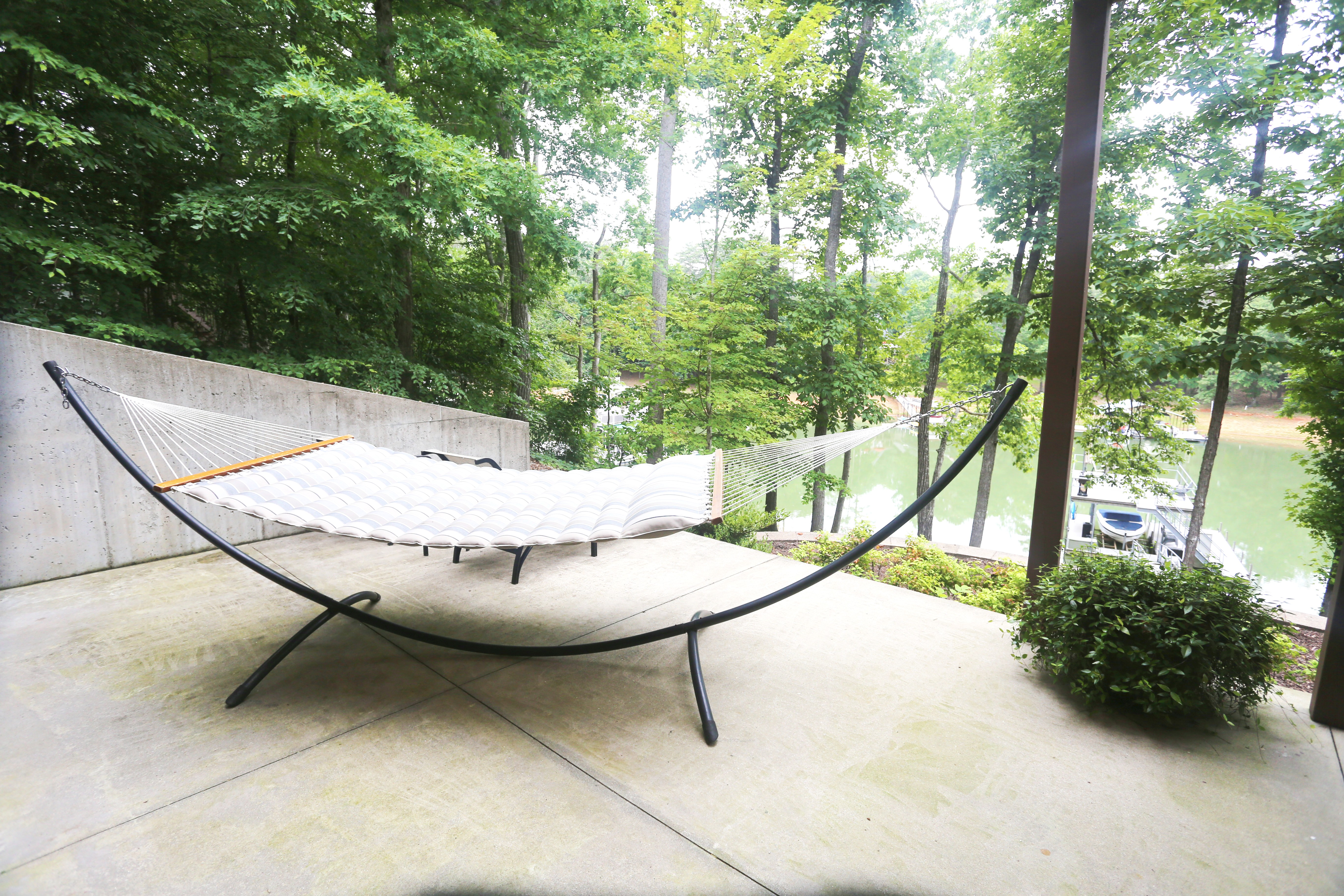 Relax in the hammock with serene wooded views by the water