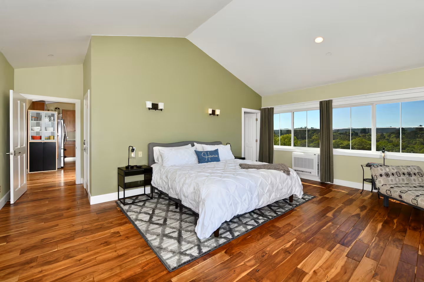 Sunny master suite with views, vaulted ceiling & hardwood floors