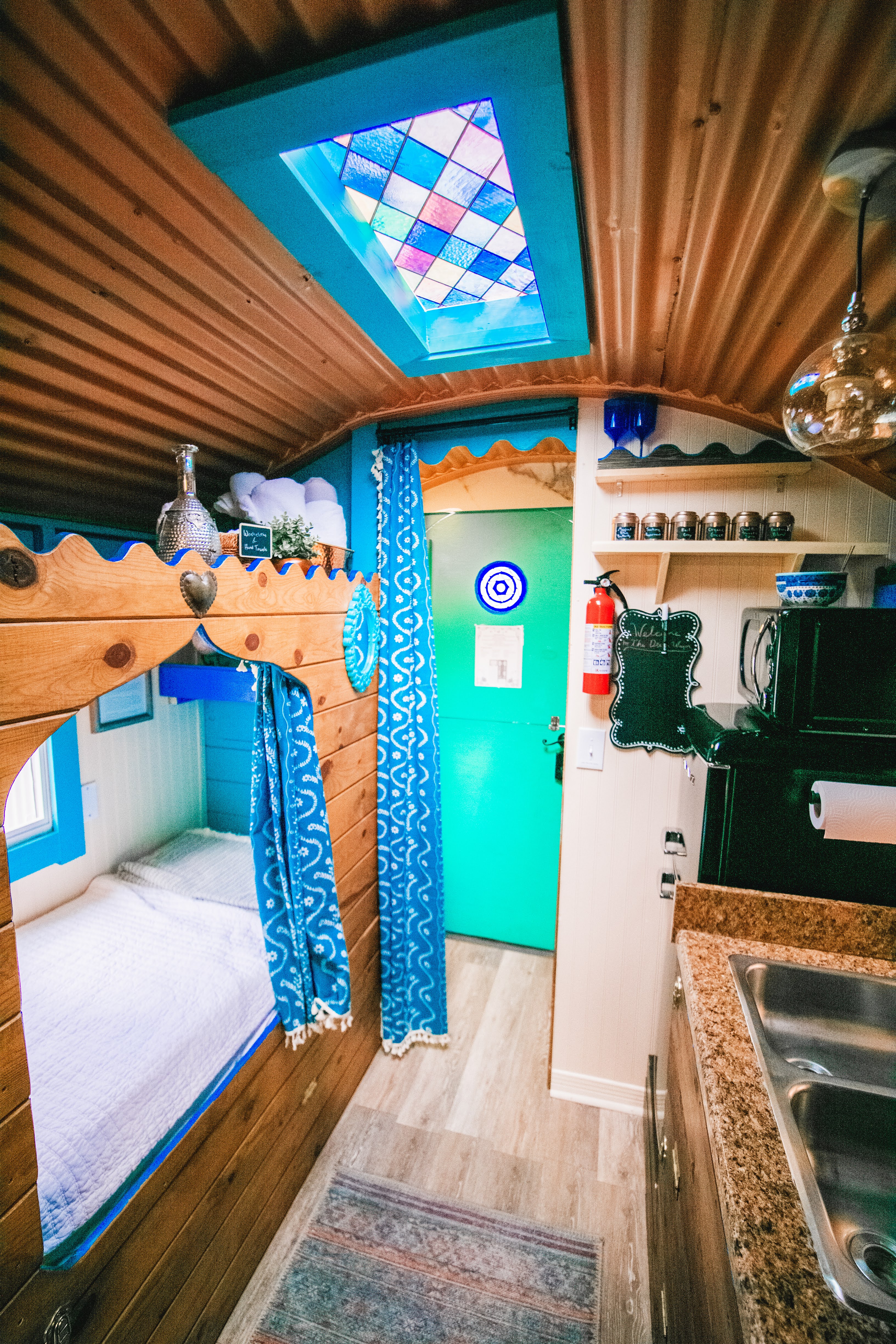 Woodwork on world cubby, also stained glass skylight and view into the bathroom and entry.
