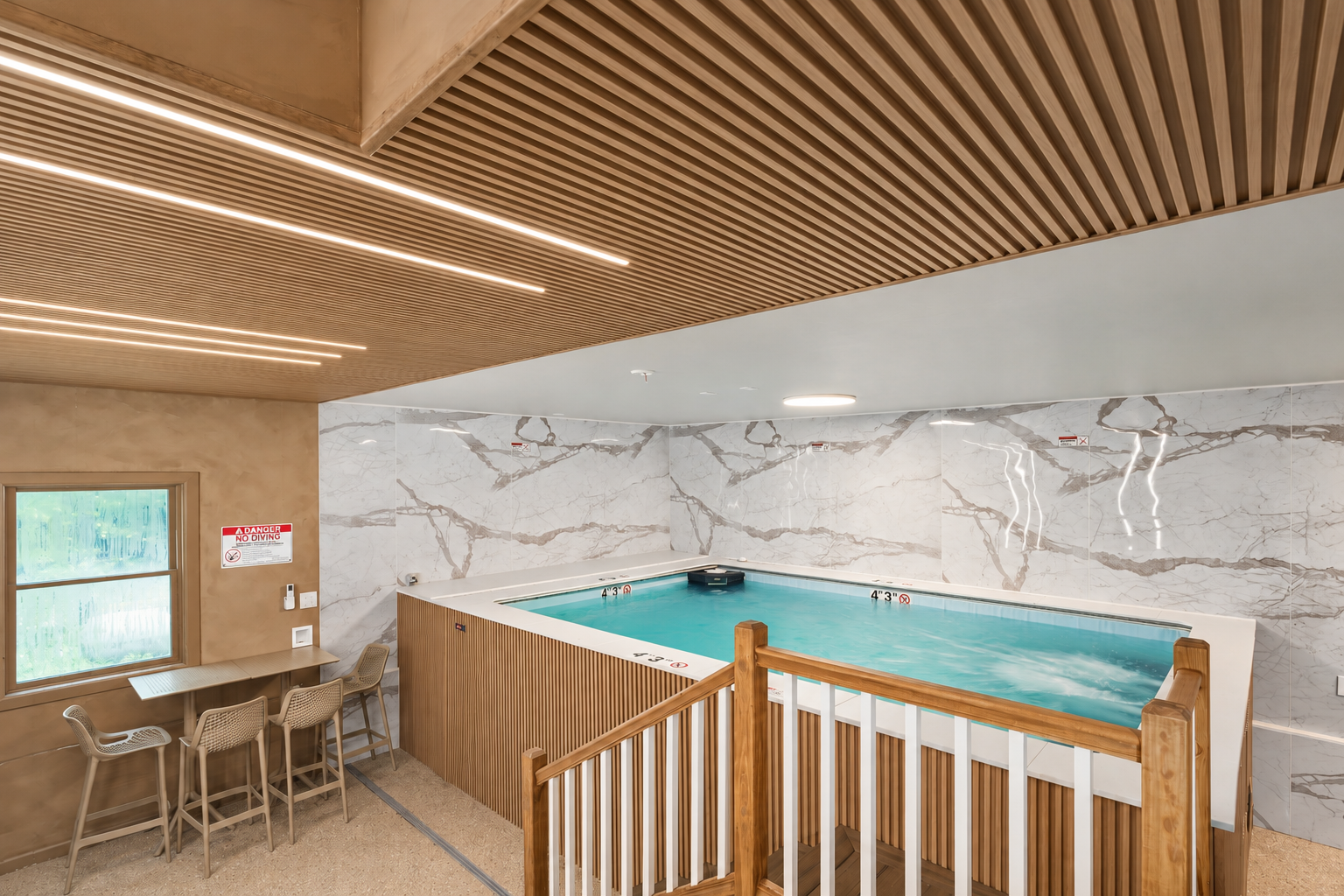 Modern indoor swim spa with elegant finishes and year-round comfort. Childproof safety cover included.