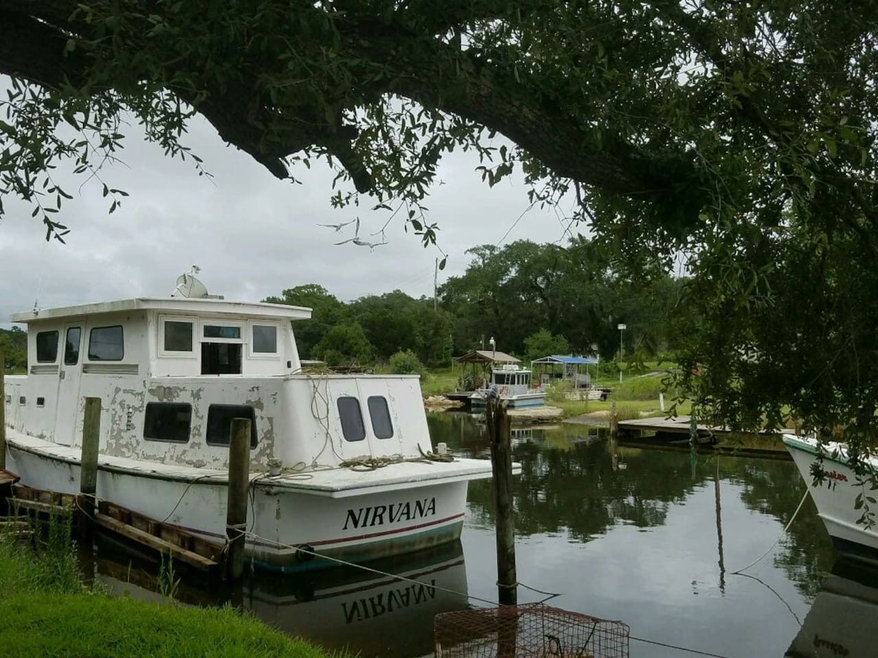 Charming old fishing boats nearby— a glimpse into Gulf Coast maritime history just minutes from your stay