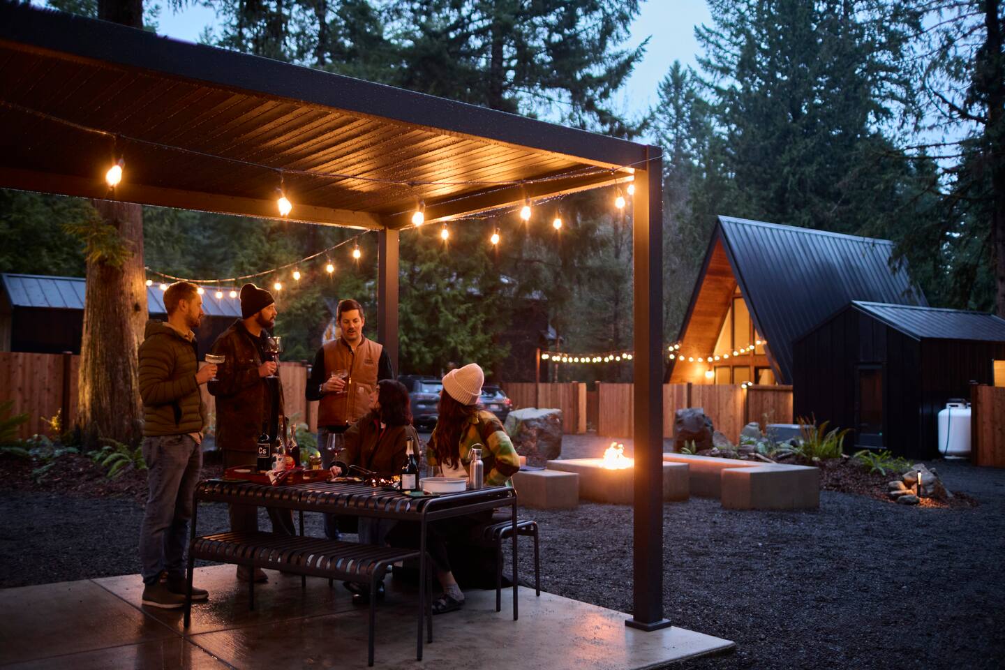 Camp Commons fire pit and outdoor dining after the sauna