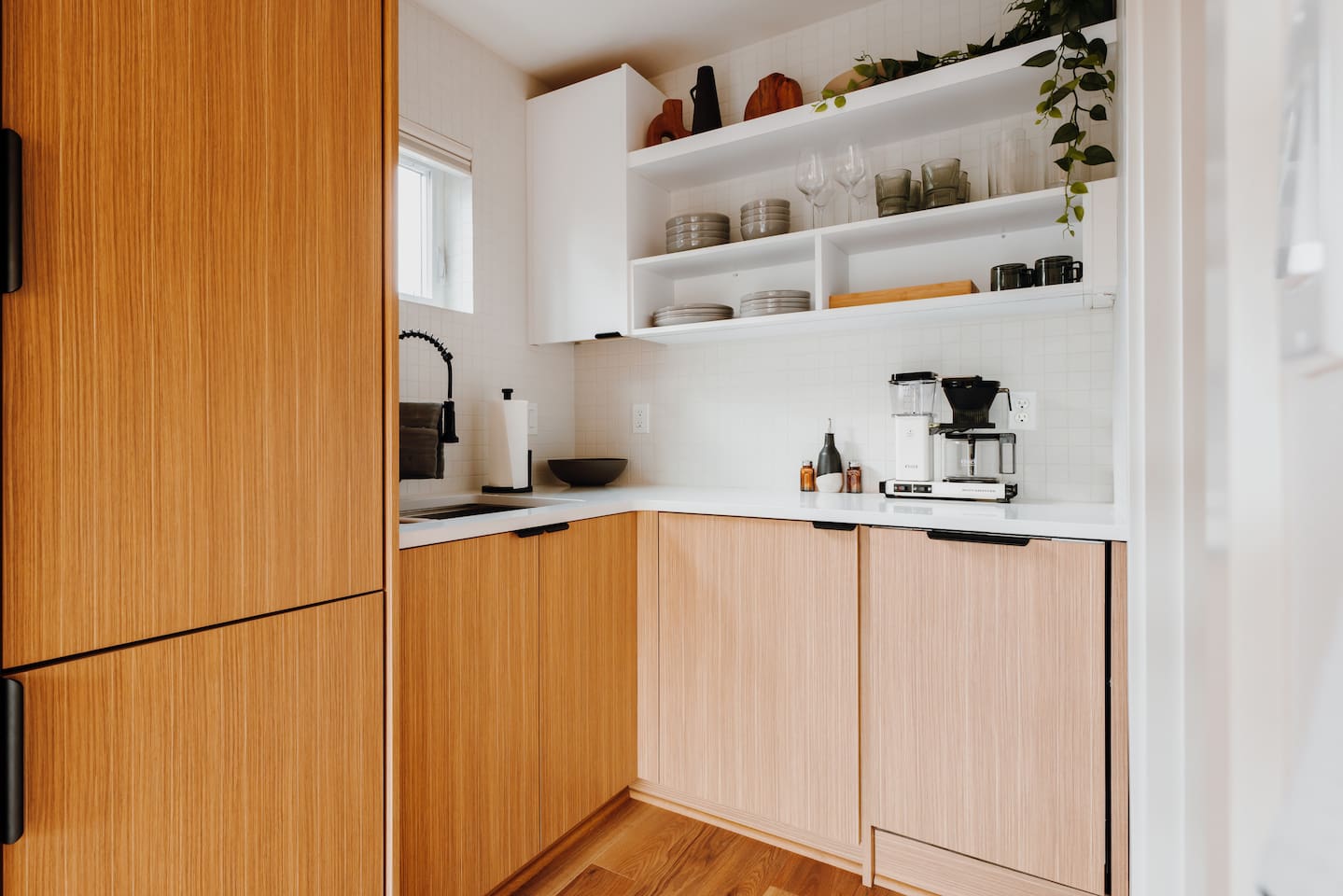 Kitchenette with built-in refrigerator and dishwasher