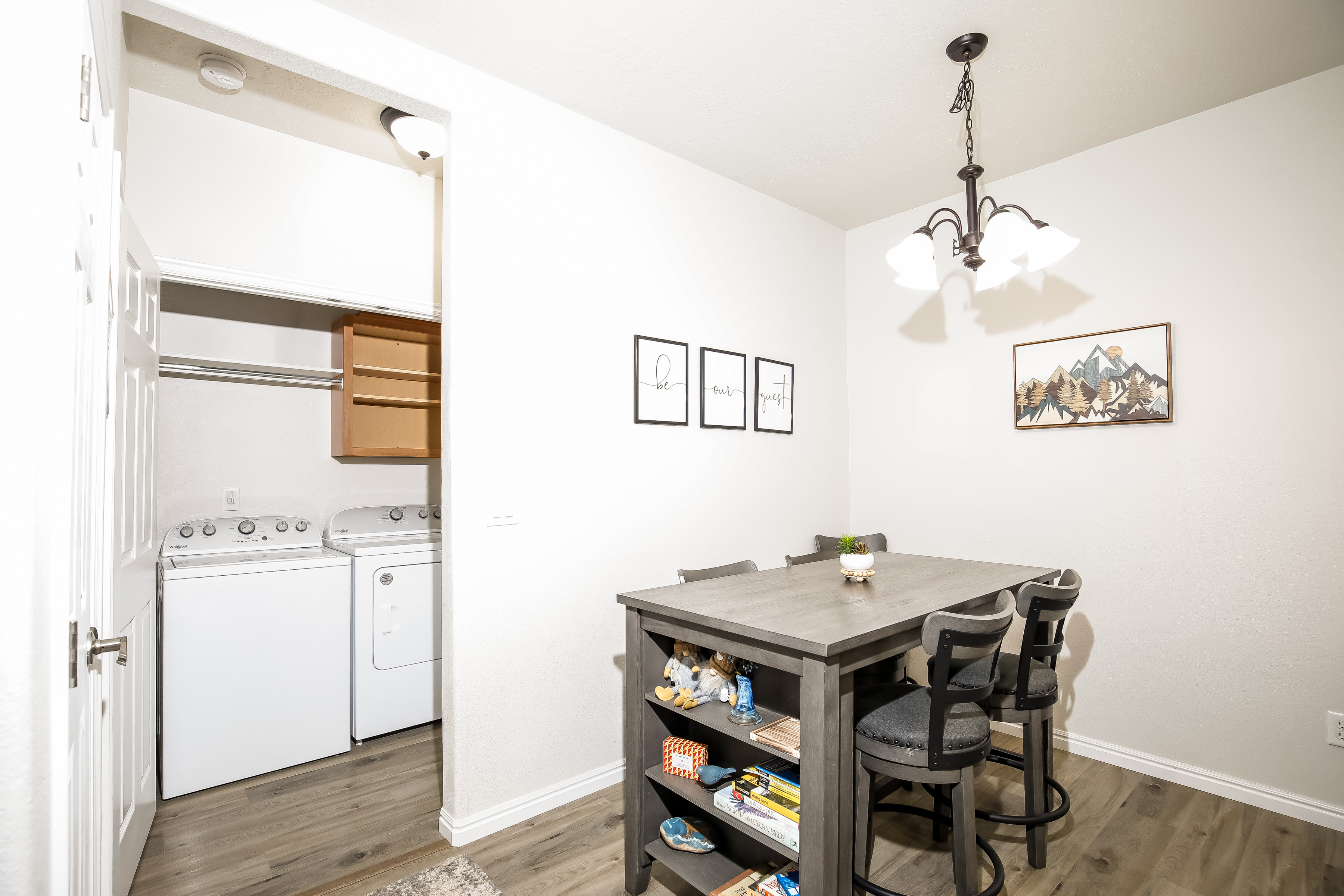 Bright dining nook with games and storage, plus convenient in-unit laundry.