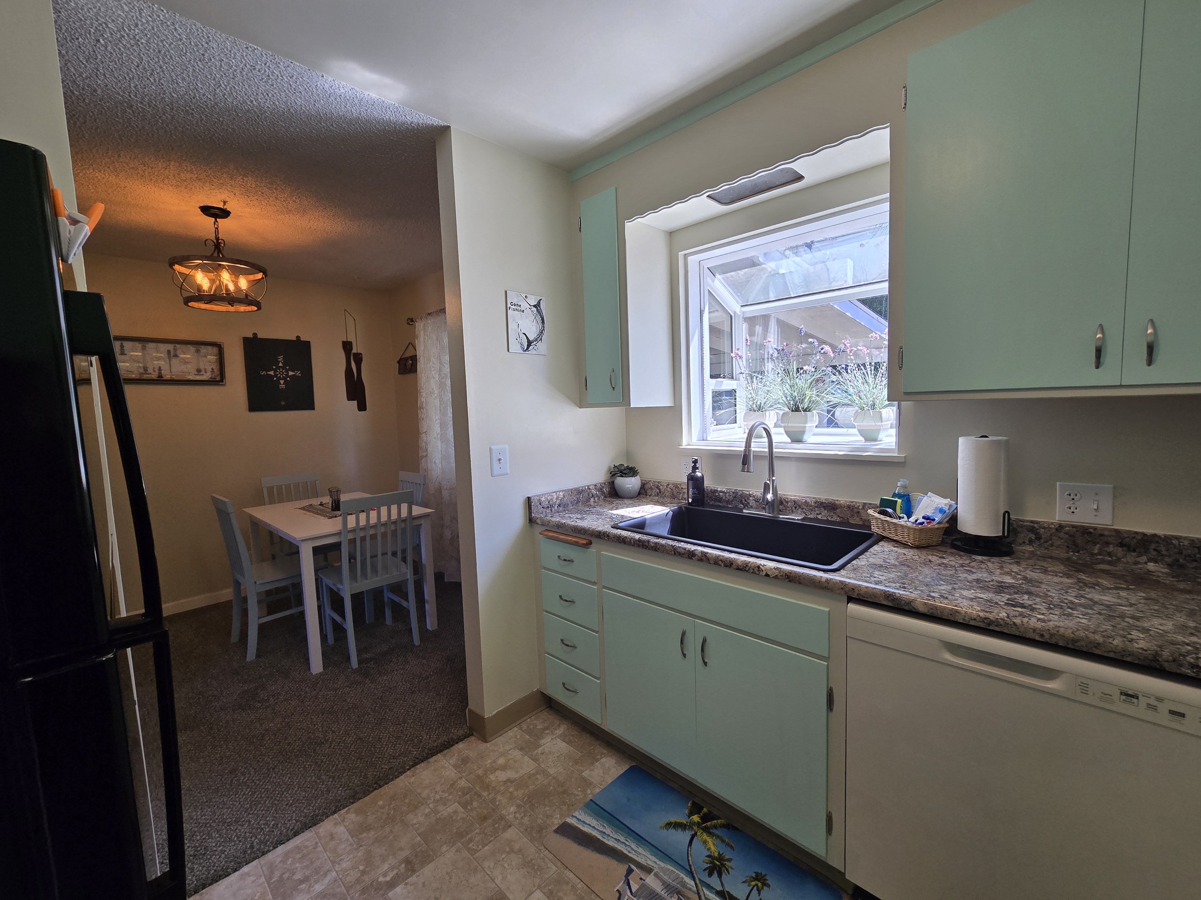 Bright vintage-style kitchen with sunny window and cozy dining nook