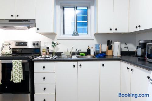 Bright full kitchen with coffee maker, microwave, and ample counter space