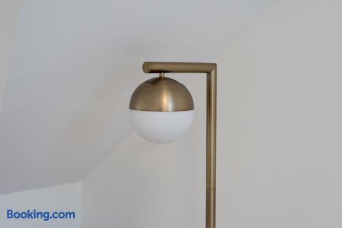 Modern brass globe lamp adds a chic touch to the bright interior