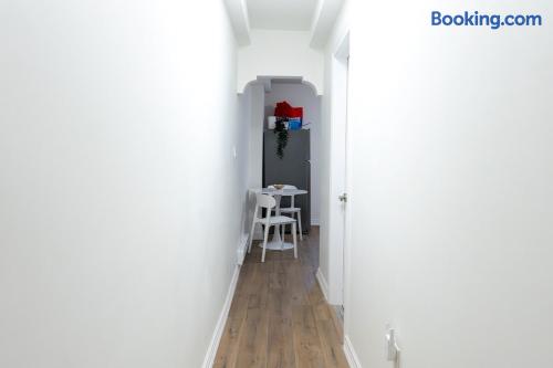 Bright hallway leading to a cozy dining nook with modern finishes