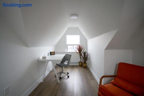 Bright loft workspace with natural light, desk, and stylish seating