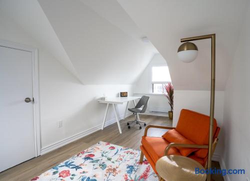 Bright loft-style nook with desk, window light, and stylish seating