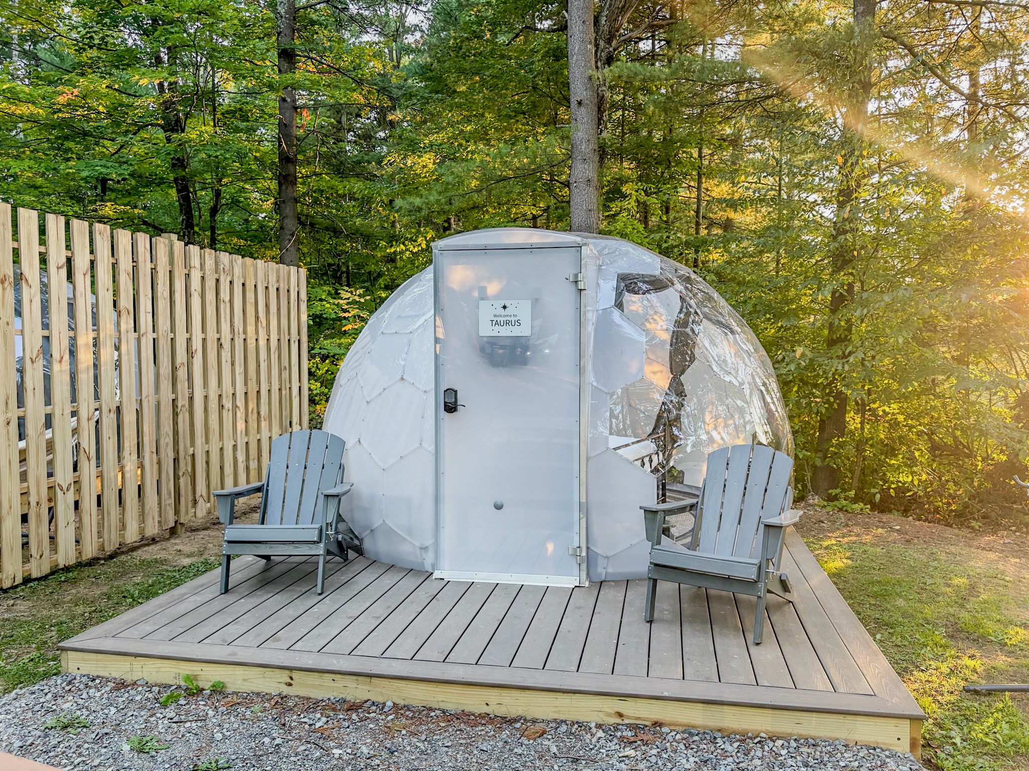 Secluded forest dome with private deck and Adirondack seating