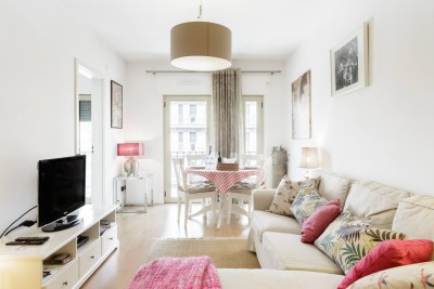 Lounge in luxury in our spacious living room, with its comfortable sofa, chic design, and entertainment system.