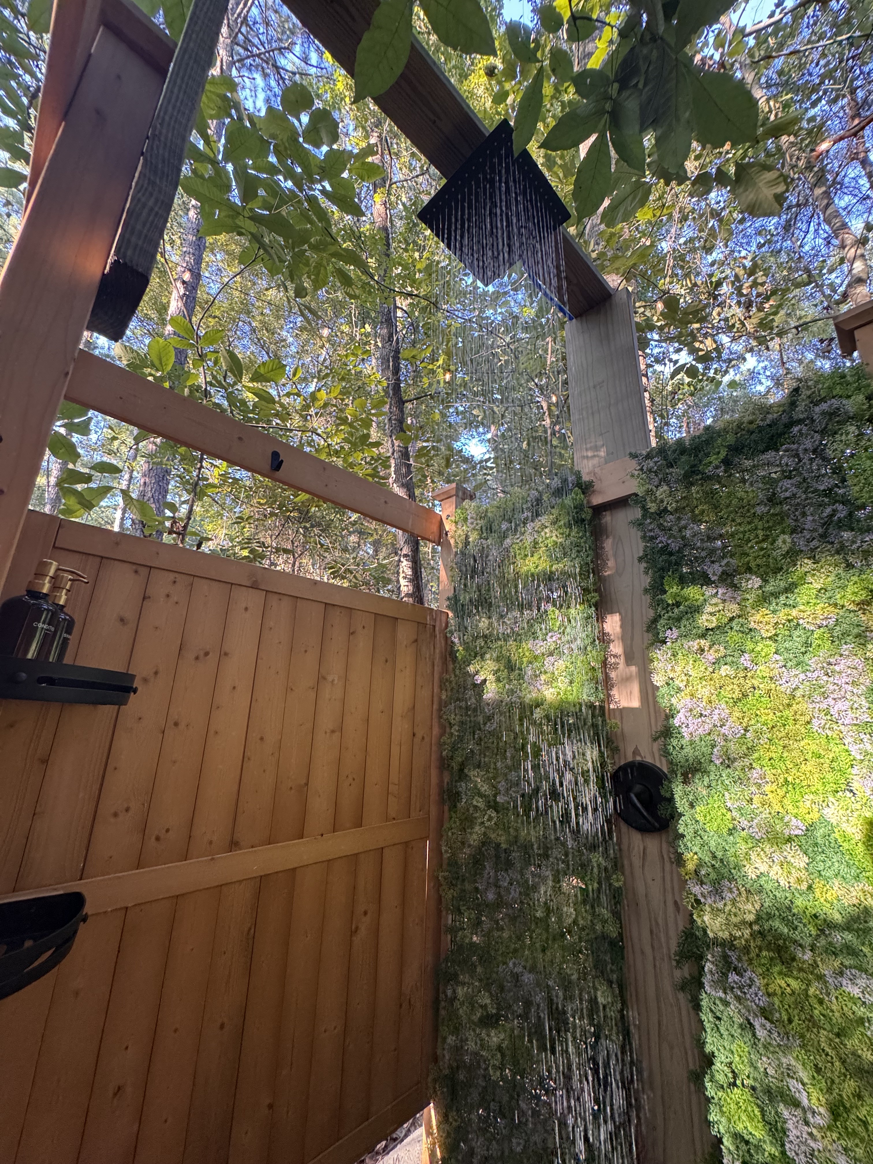 Outdoor rain shower under the trees