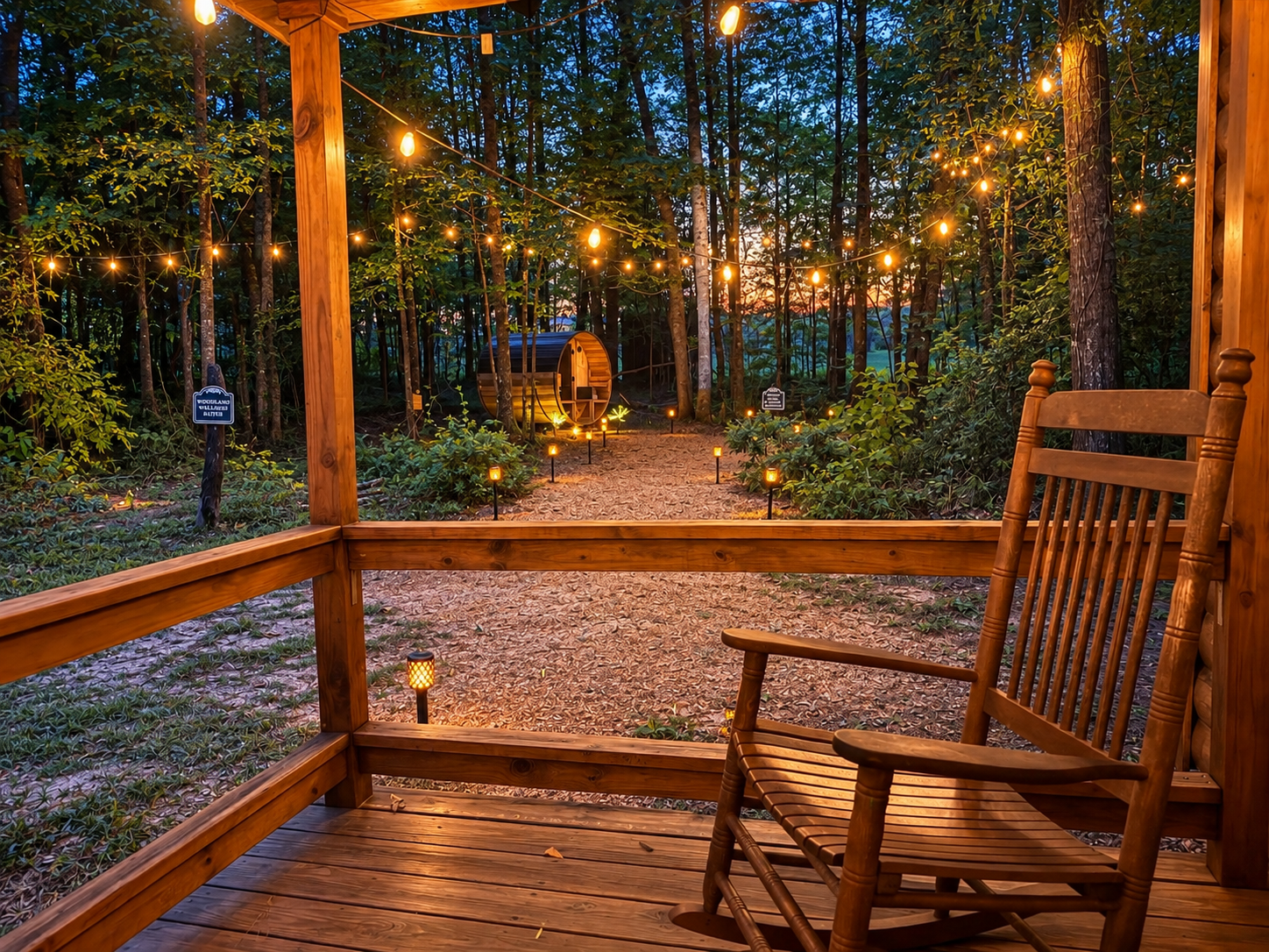 Cozy forest porch with string lights and a private barrel sauna