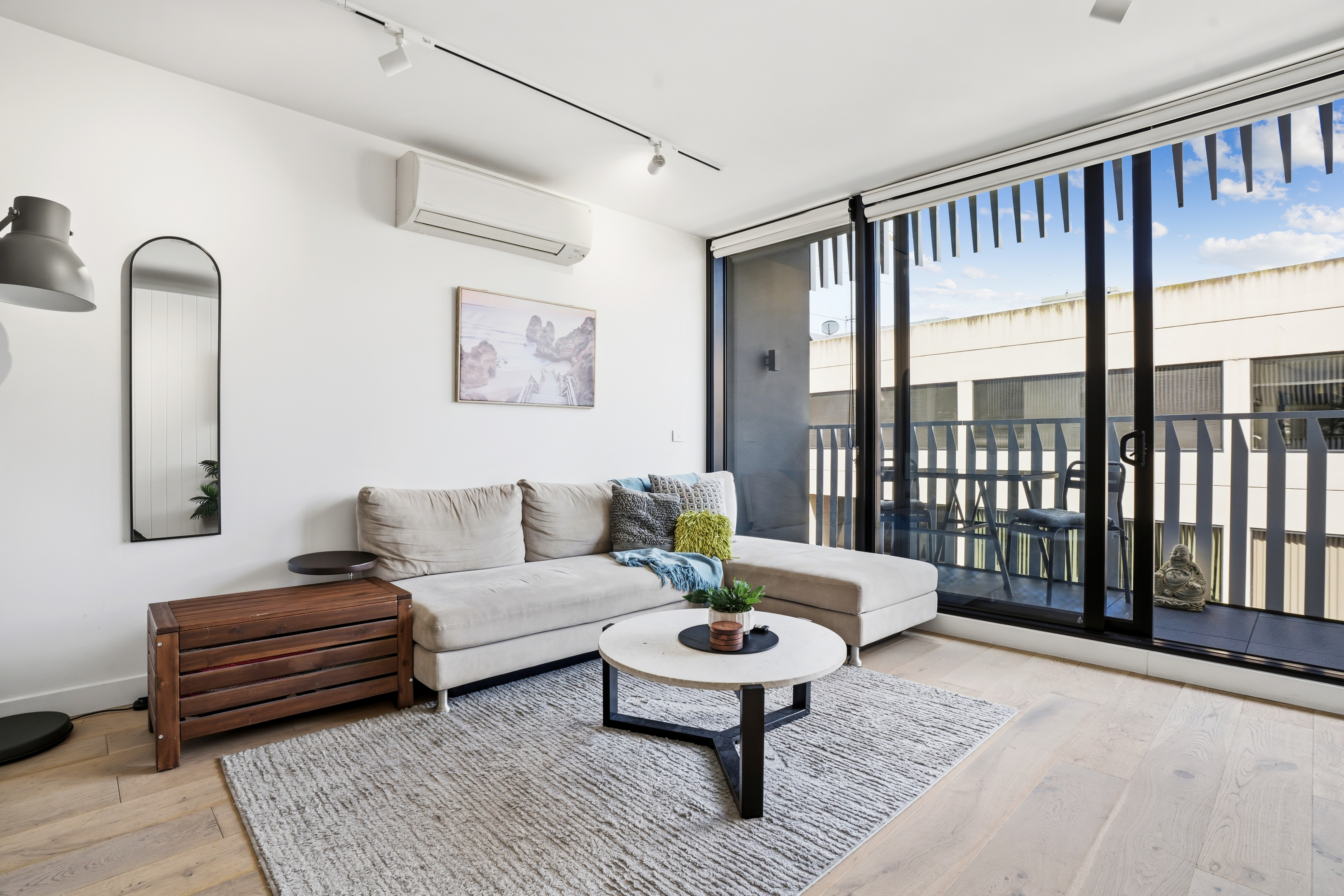 Bright modern lounge with balcony access and abundant natural light