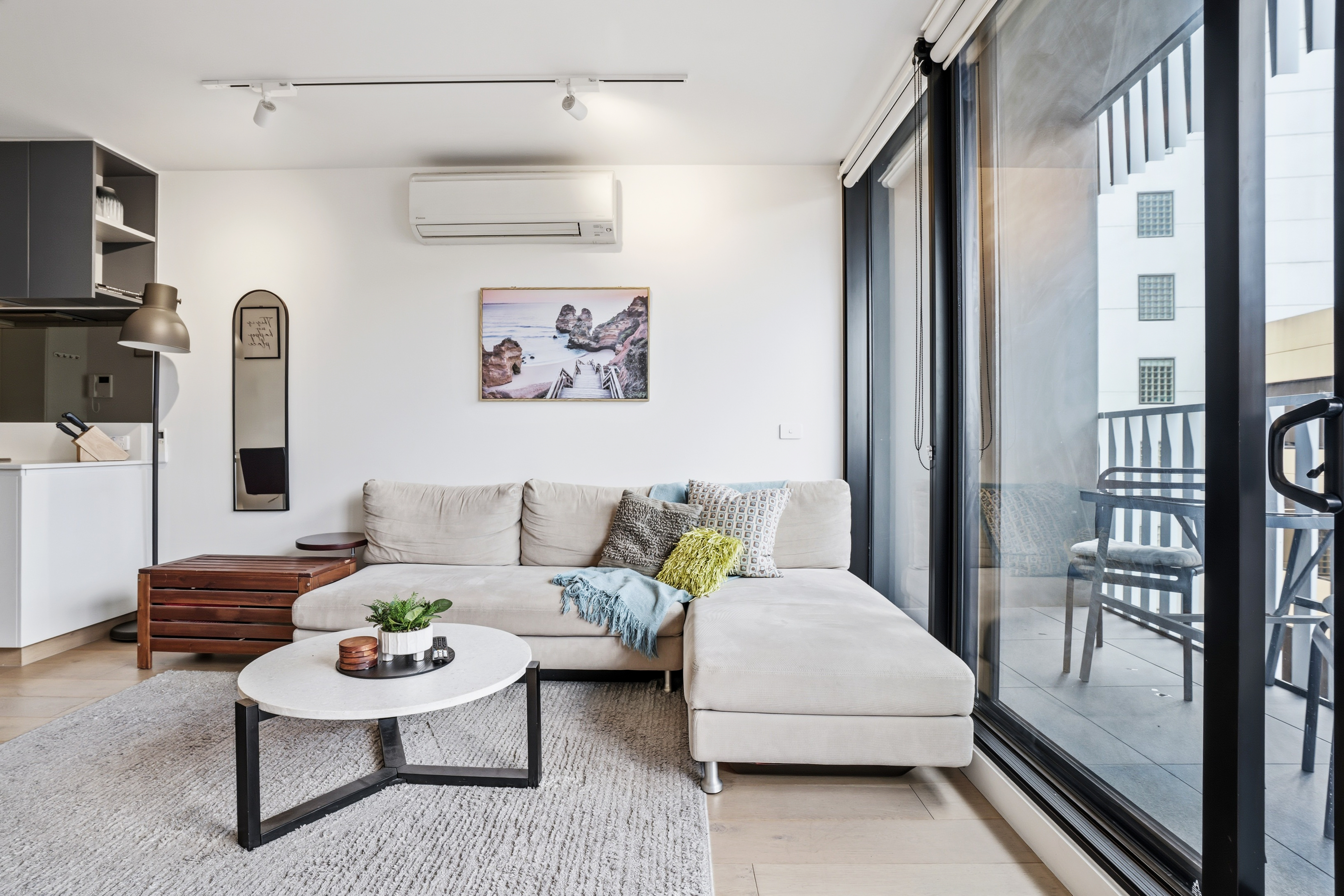 Bright modern lounge with balcony seating and natural light