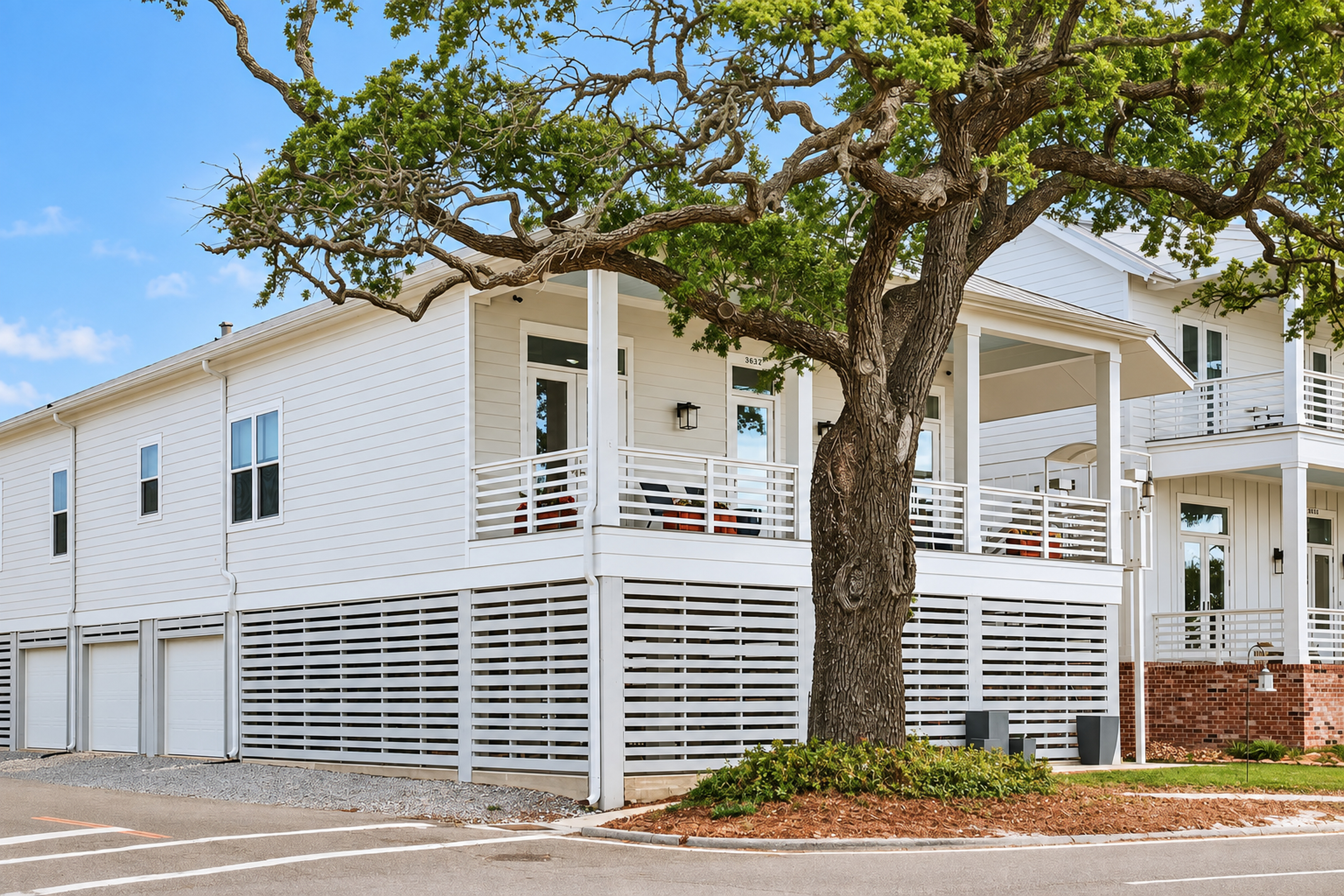 Charming coastal home with wraparound porch and shady mature tree