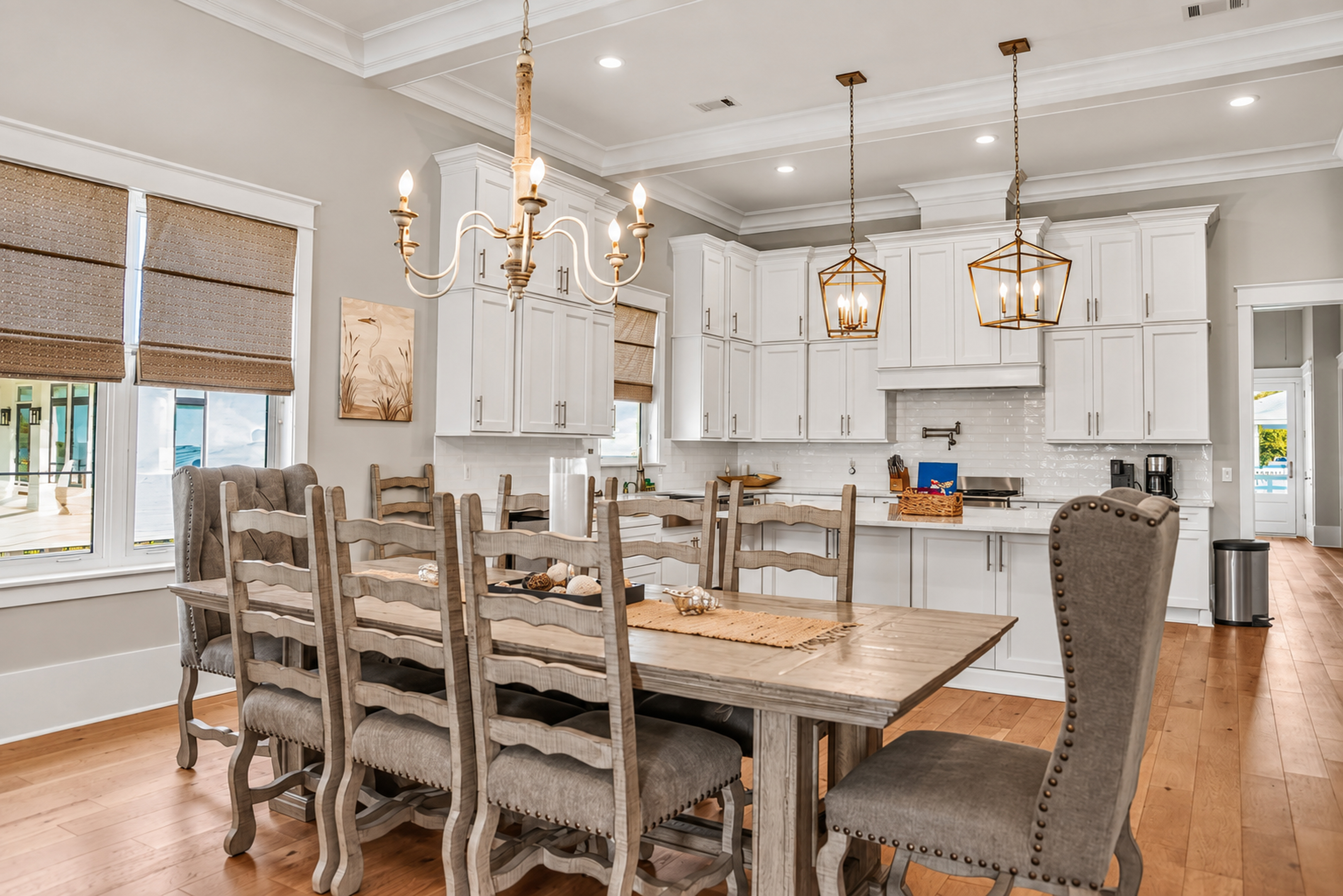 Elegant open dining area with seating for 8 beside a bright gourmet kitchen