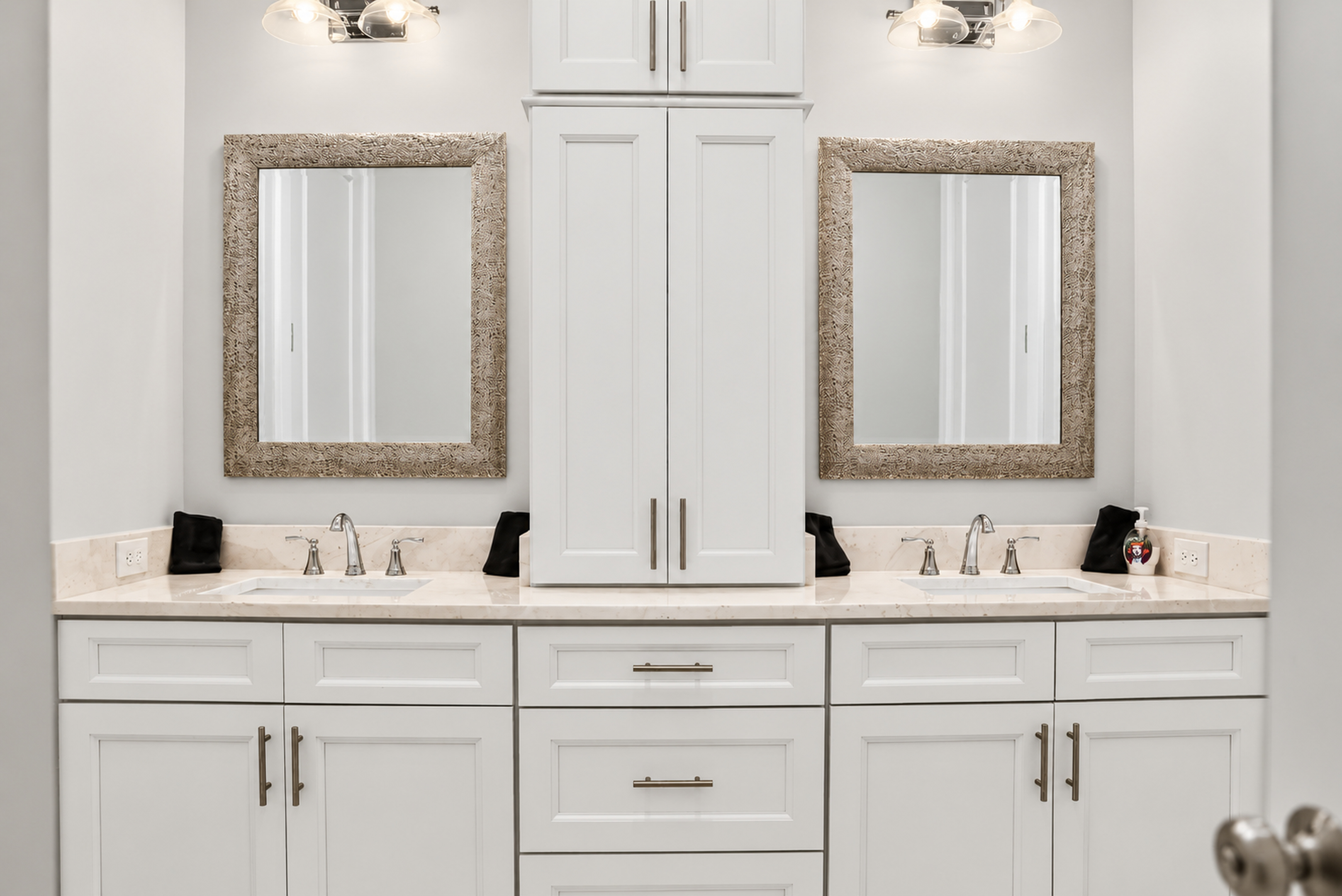 Bright double vanity bathroom with dual sinks and ample storage