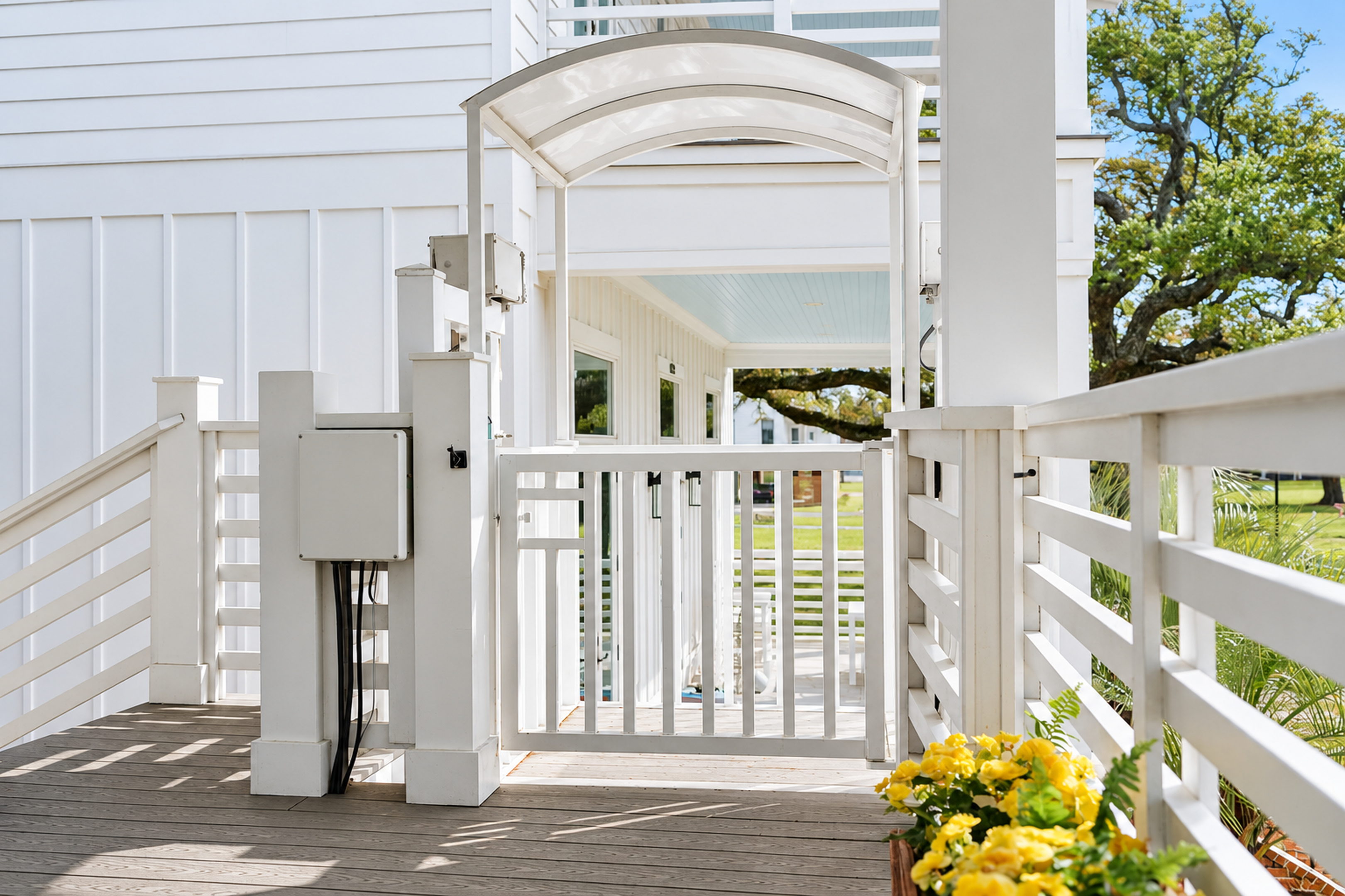 Bright accessible entry deck with covered lift and clean coastal style