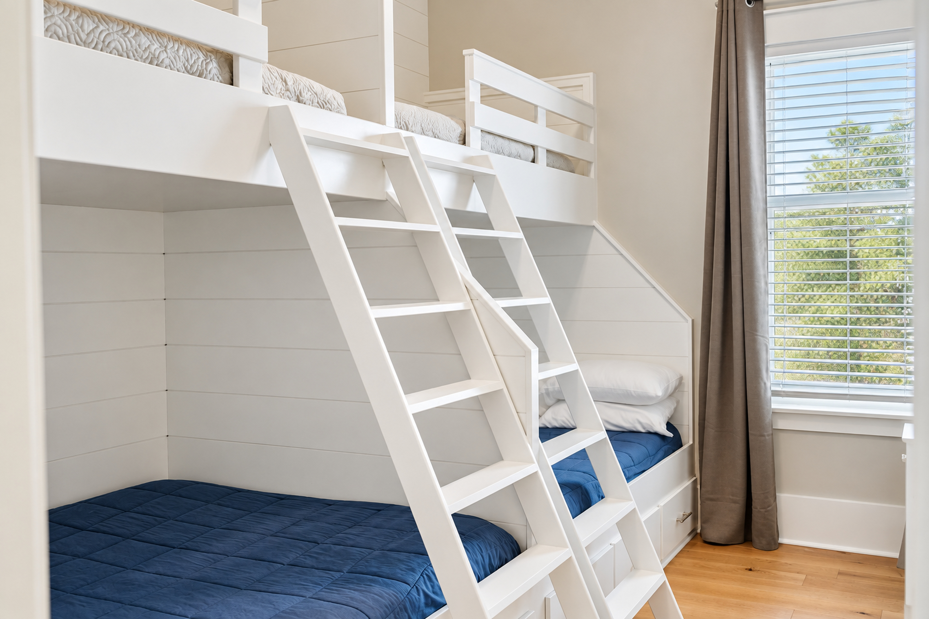 Bright custom bunk room with built-in beds, natural light, and family-friendly style