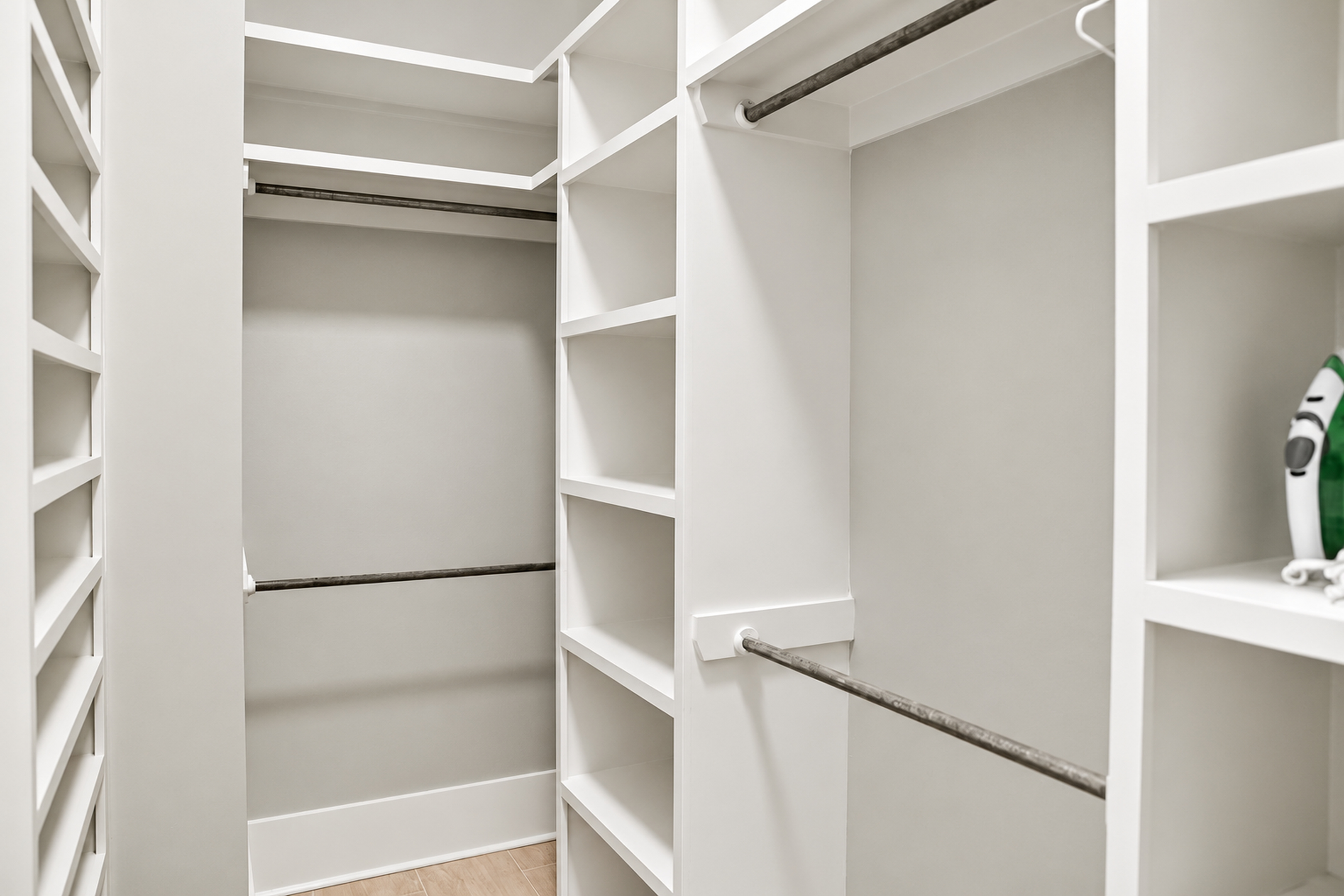 Spacious walk-in closet with custom shelving and ample hanging space