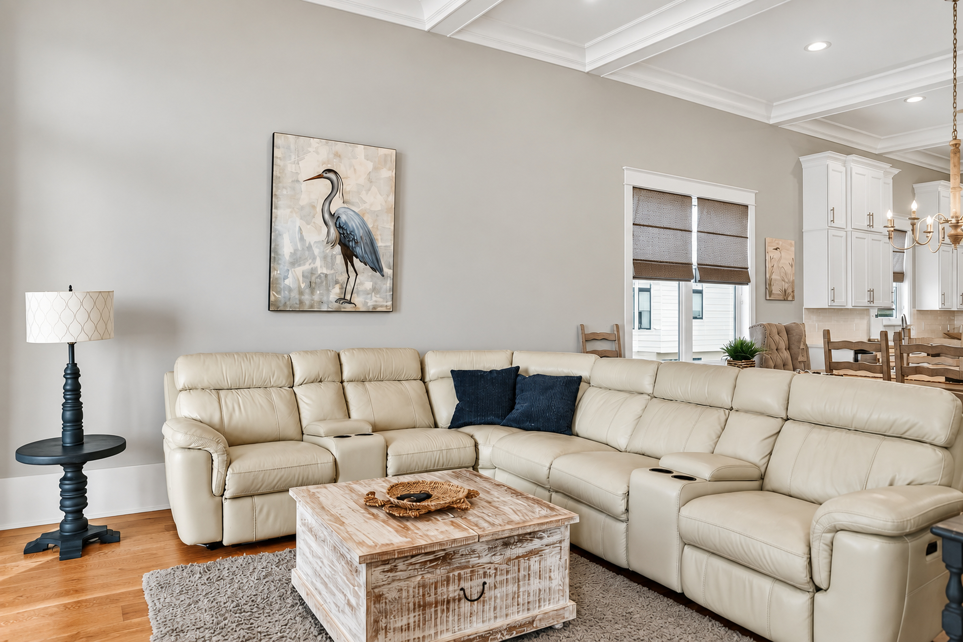 Spacious living room with plush sectional and elegant open-concept design