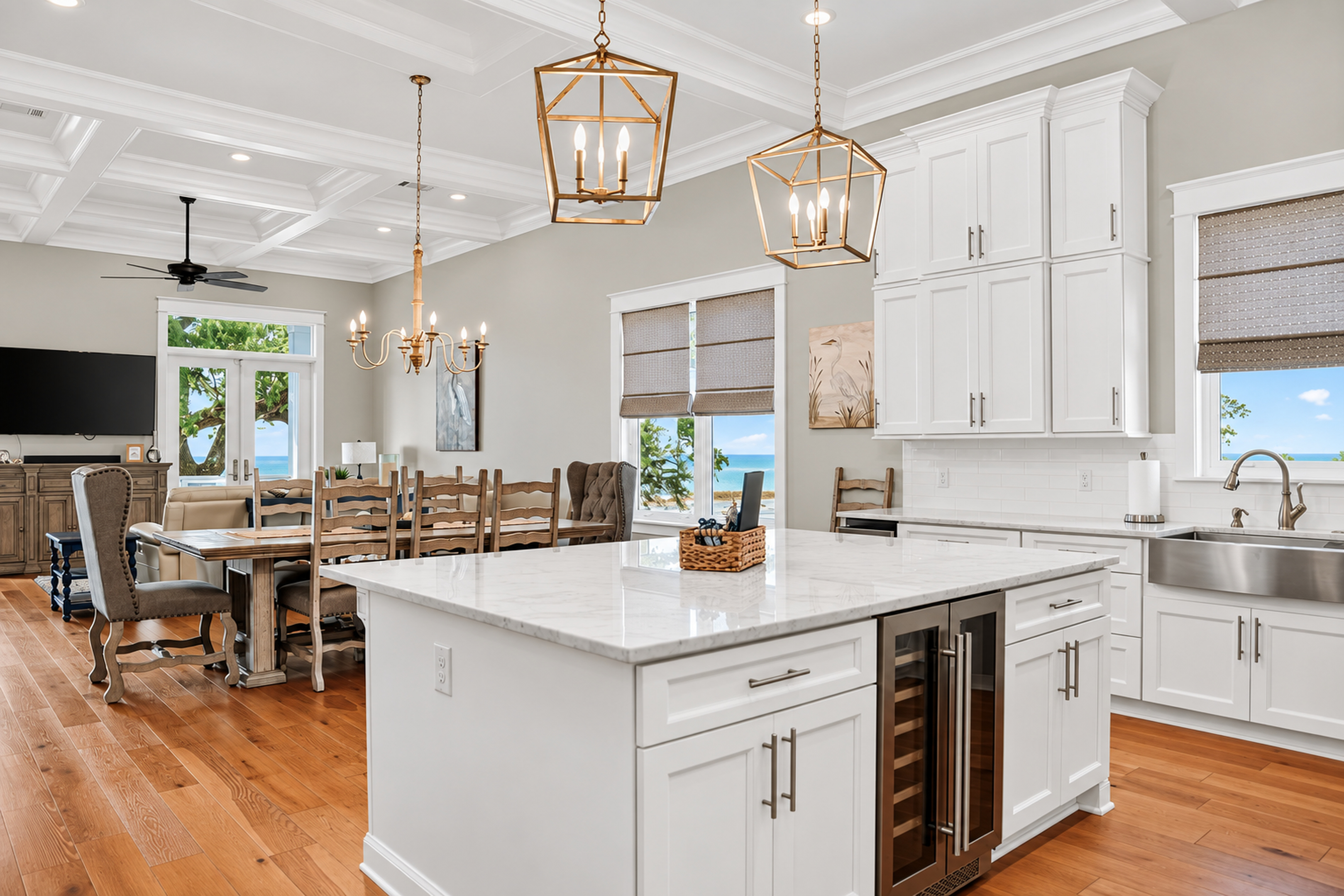 Bright gourmet kitchen and dining space with stunning water views