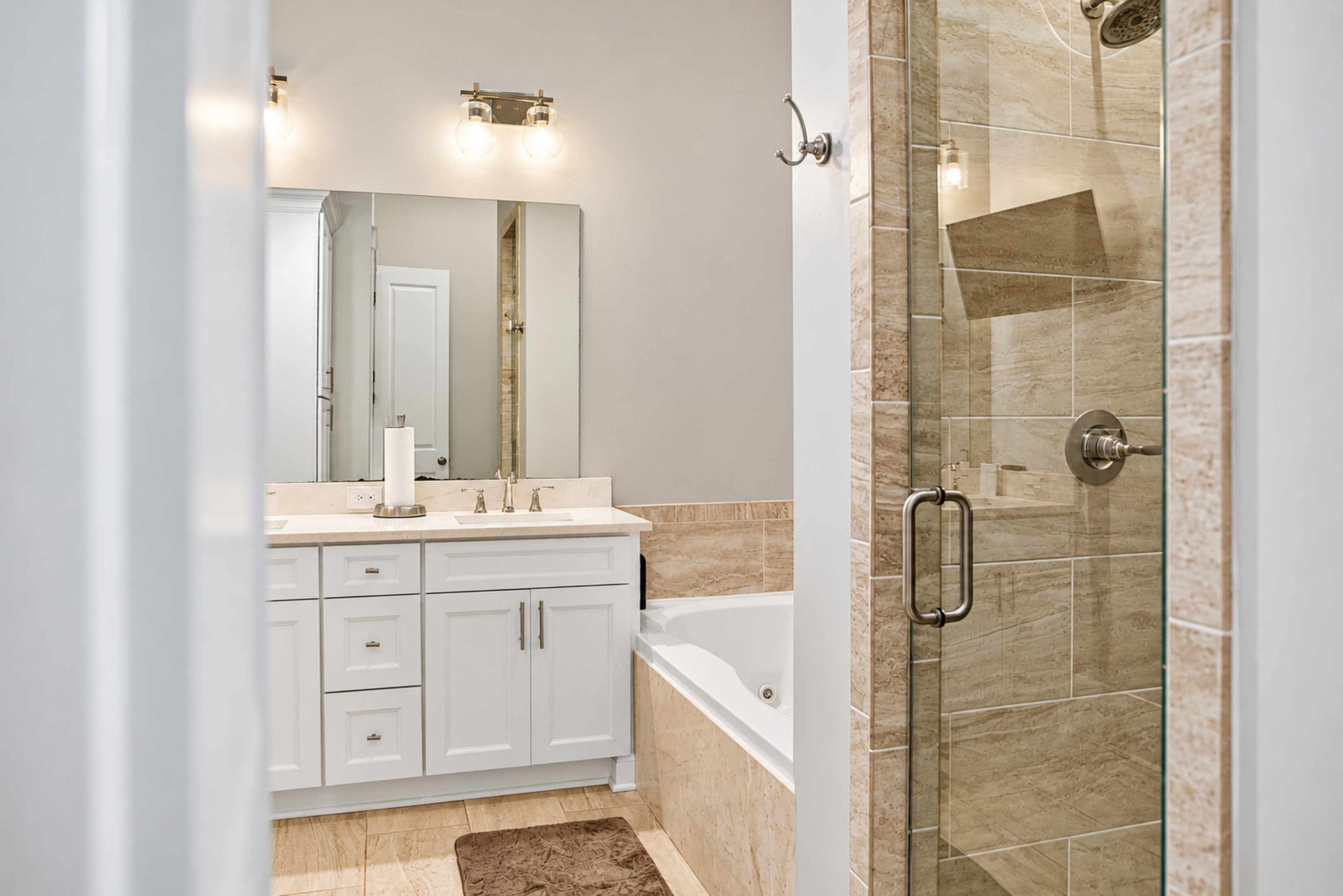 Modern spa-like bathroom with soaking tub and glass walk-in shower