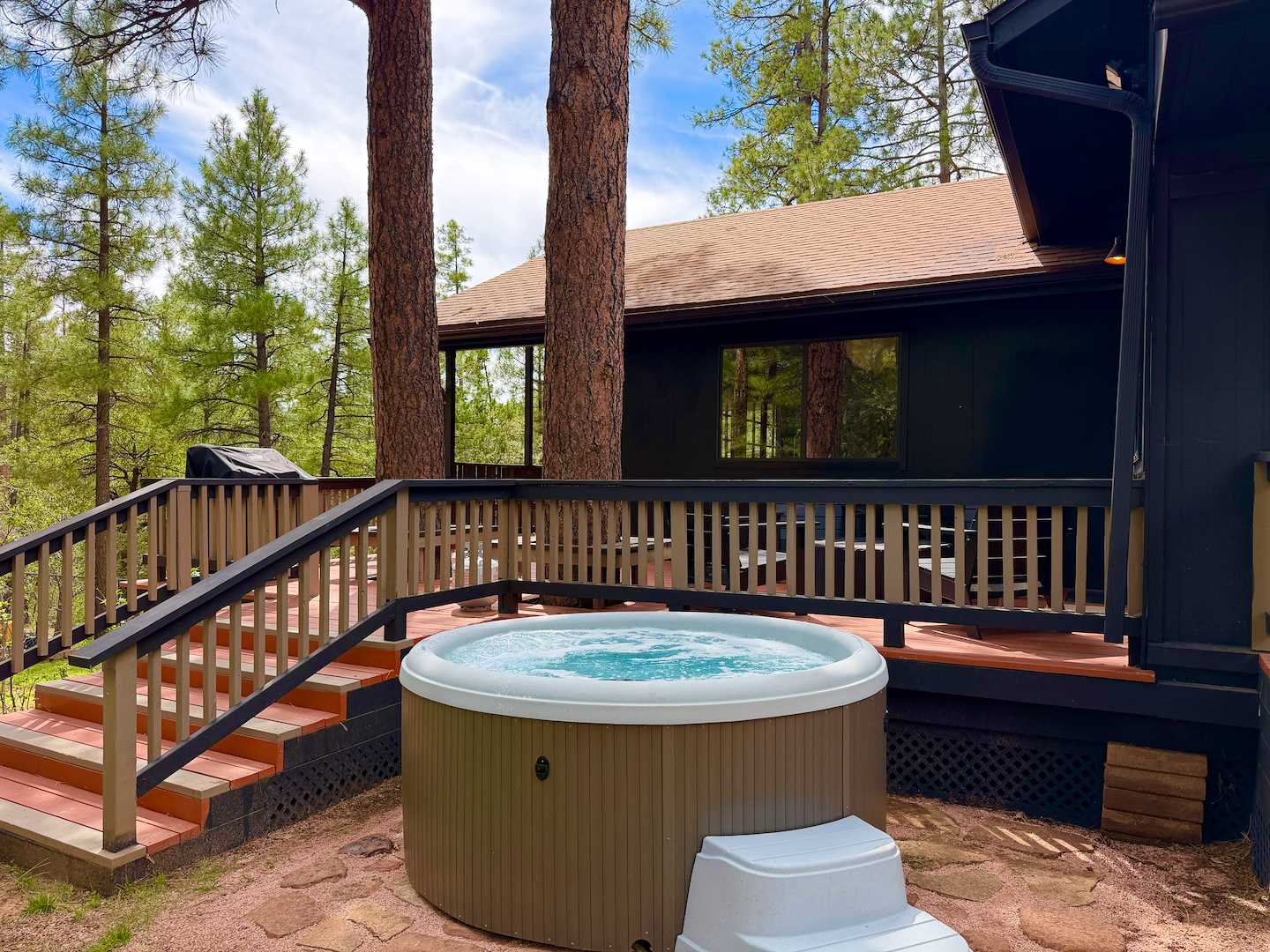 Private hot tub and forest-view deck for the ultimate cabin retreat