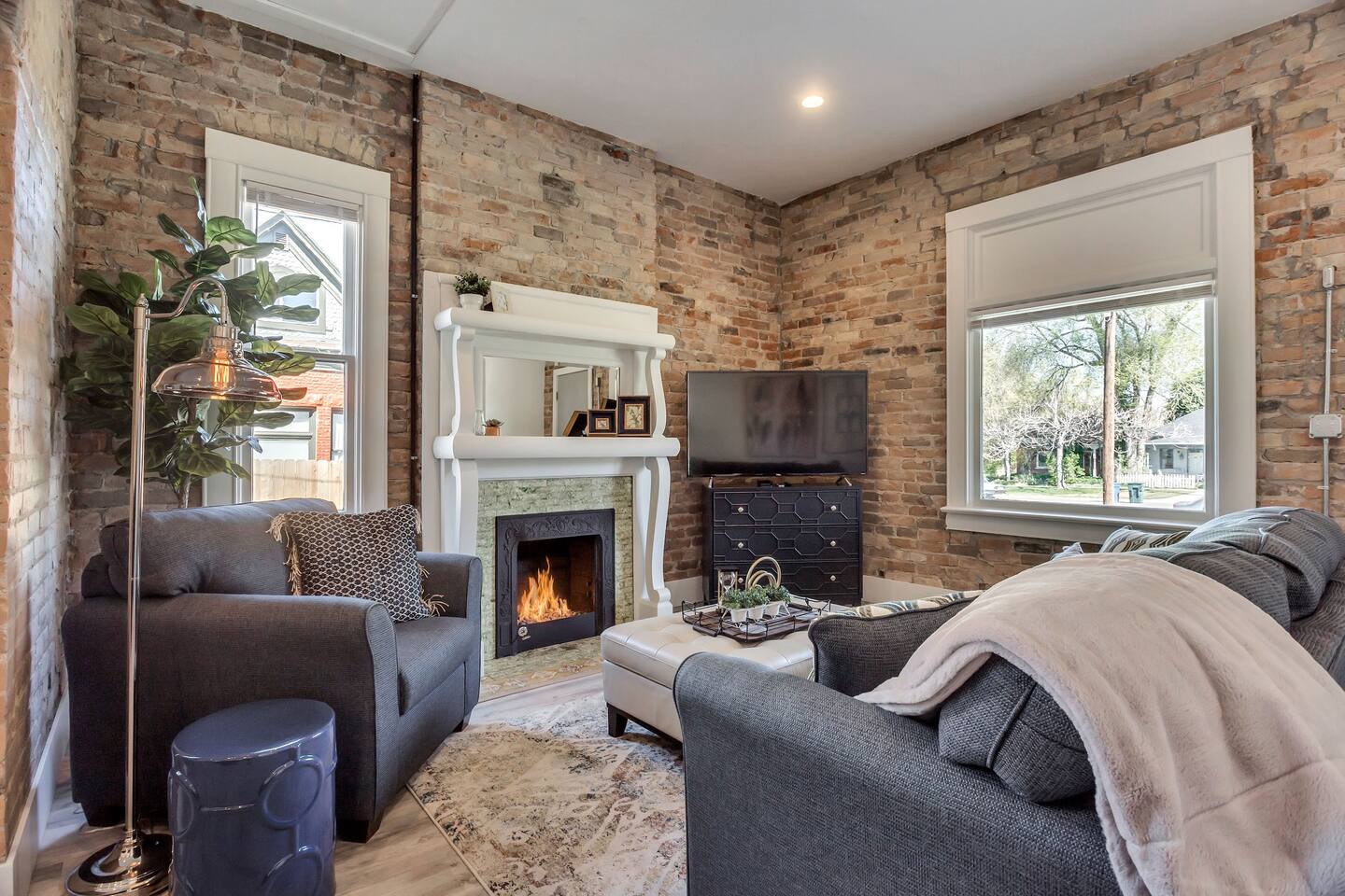 Chic Brick Loft with Fireplace & King Bed