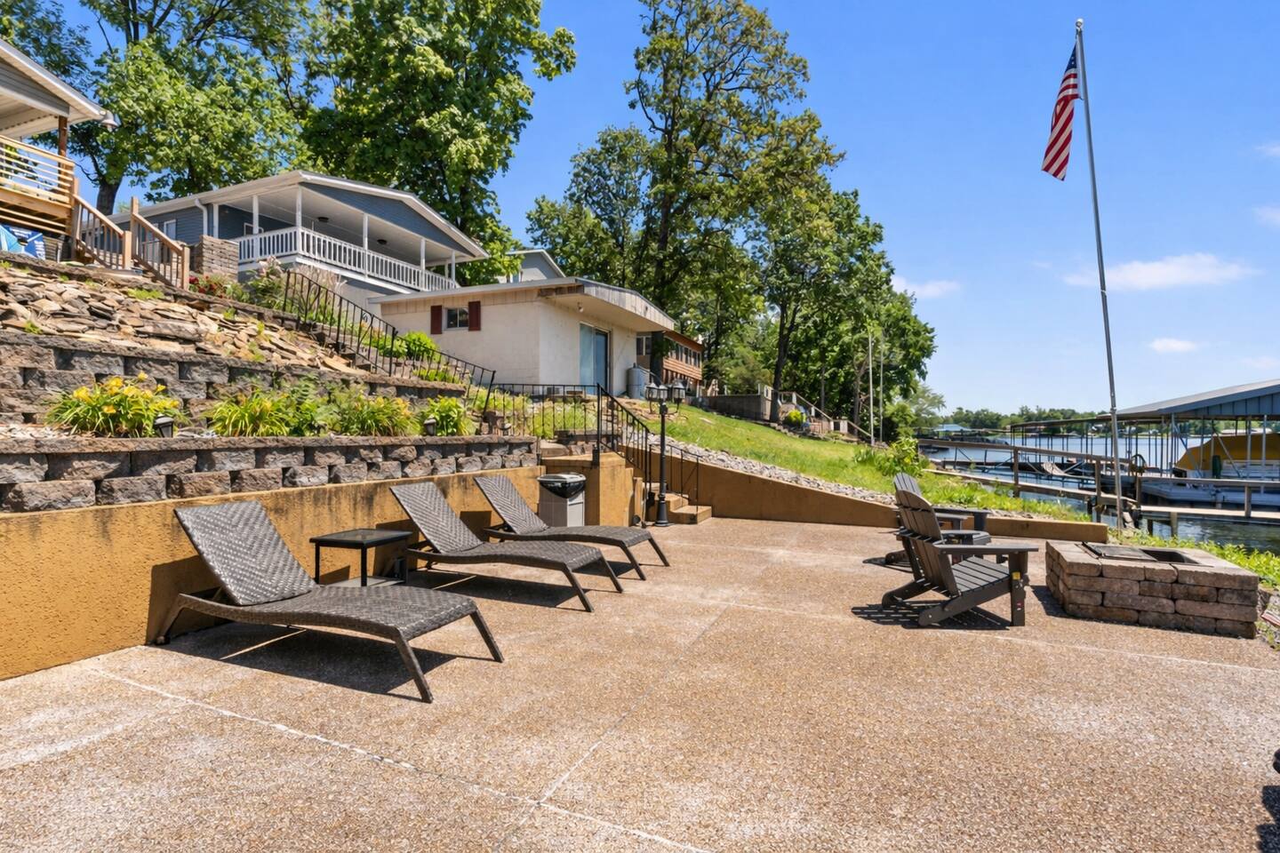 Lakeside patio with lounge chairs