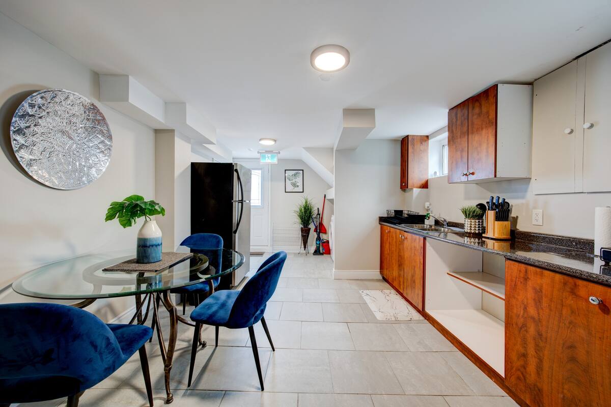 Bright kitchenette with granite counters and chic dining nook