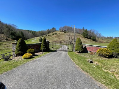 Gated country estate with winding drive and serene hilltop views