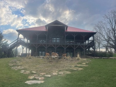 Rustic lodge with wraparound deck, hillside fire pit, sweeping views